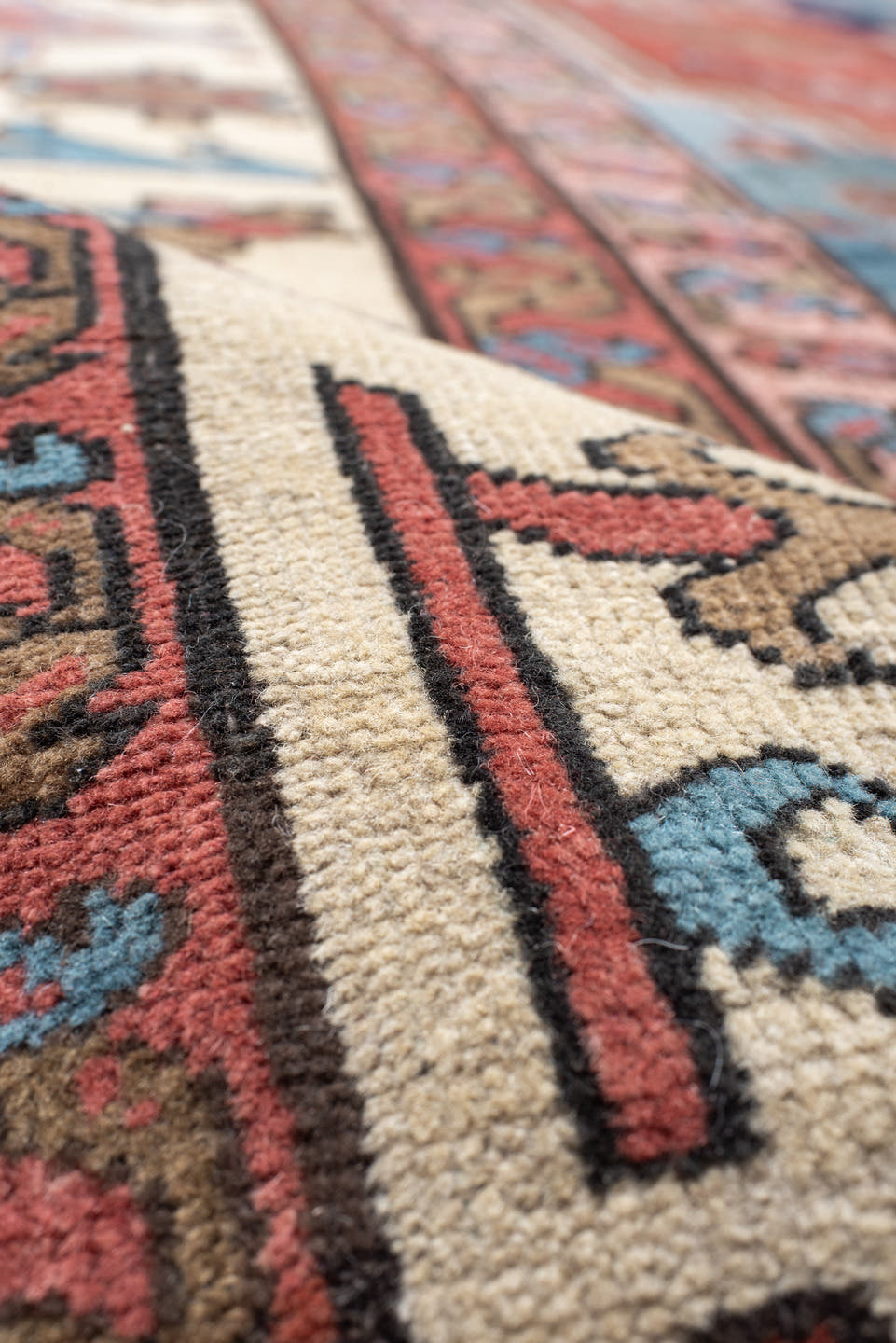 11' x 16' one-of-a-kind handmade vintage Serapi oversize rug. Color palette: terra cotta, ivory, sky blue, navy, rose