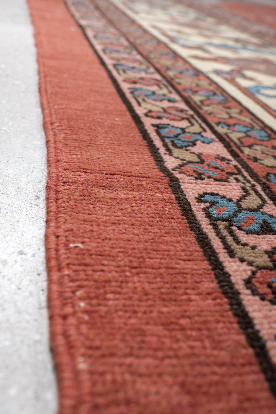 11' x 16' one-of-a-kind handmade vintage Serapi oversize rug. Color palette: terra cotta, ivory, sky blue, navy, rose