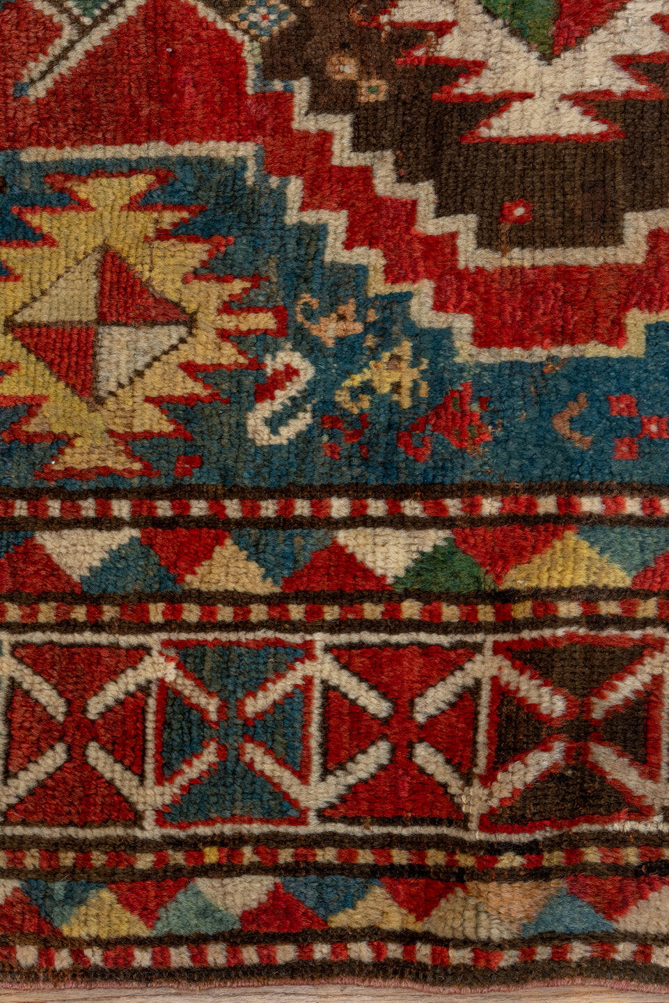 3' x 7' one-of-a-kind handmade antique Kazak rug. Color palette: rust, sky blue, ivory, navy, brown, black, camel, red