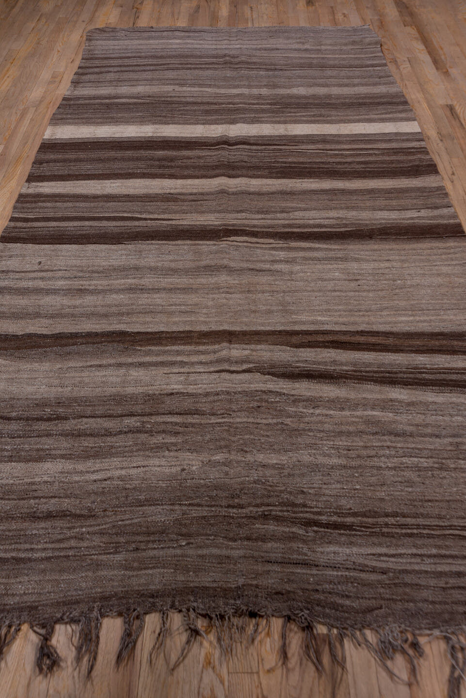 5' x 10' one-of-a-kind handmade vintage Kilim medium size rug. Color palette: taupe, brown, charcoal, mushroom, ivory, beige