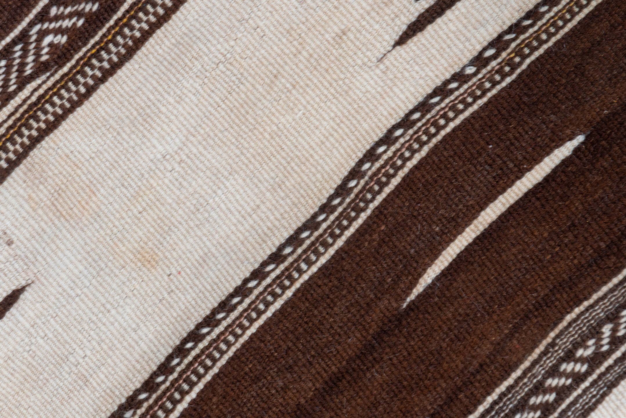 4' x 11' one-of-a-kind handmade vintage Kilim runner rug. Color palette: taupe, brown, ivory, charcoal, beige, gray, black