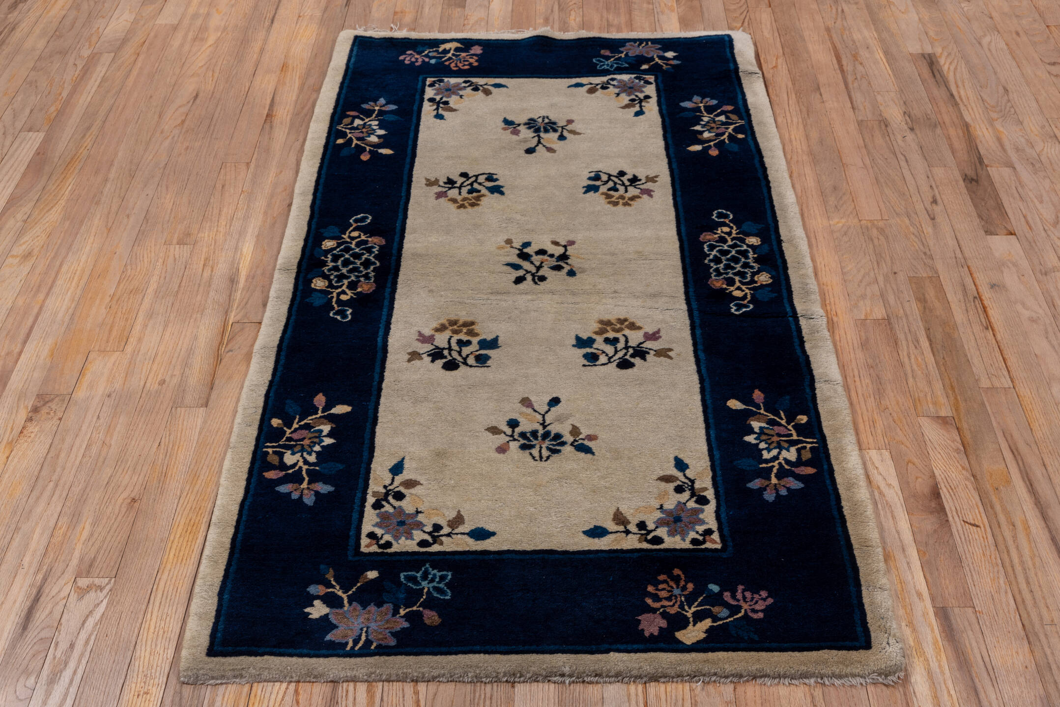 3' x 6' one-of-a-kind handmade vintage Chinese small size rug. Color palette: navy, ivory, blue, lavender, taupe, camel