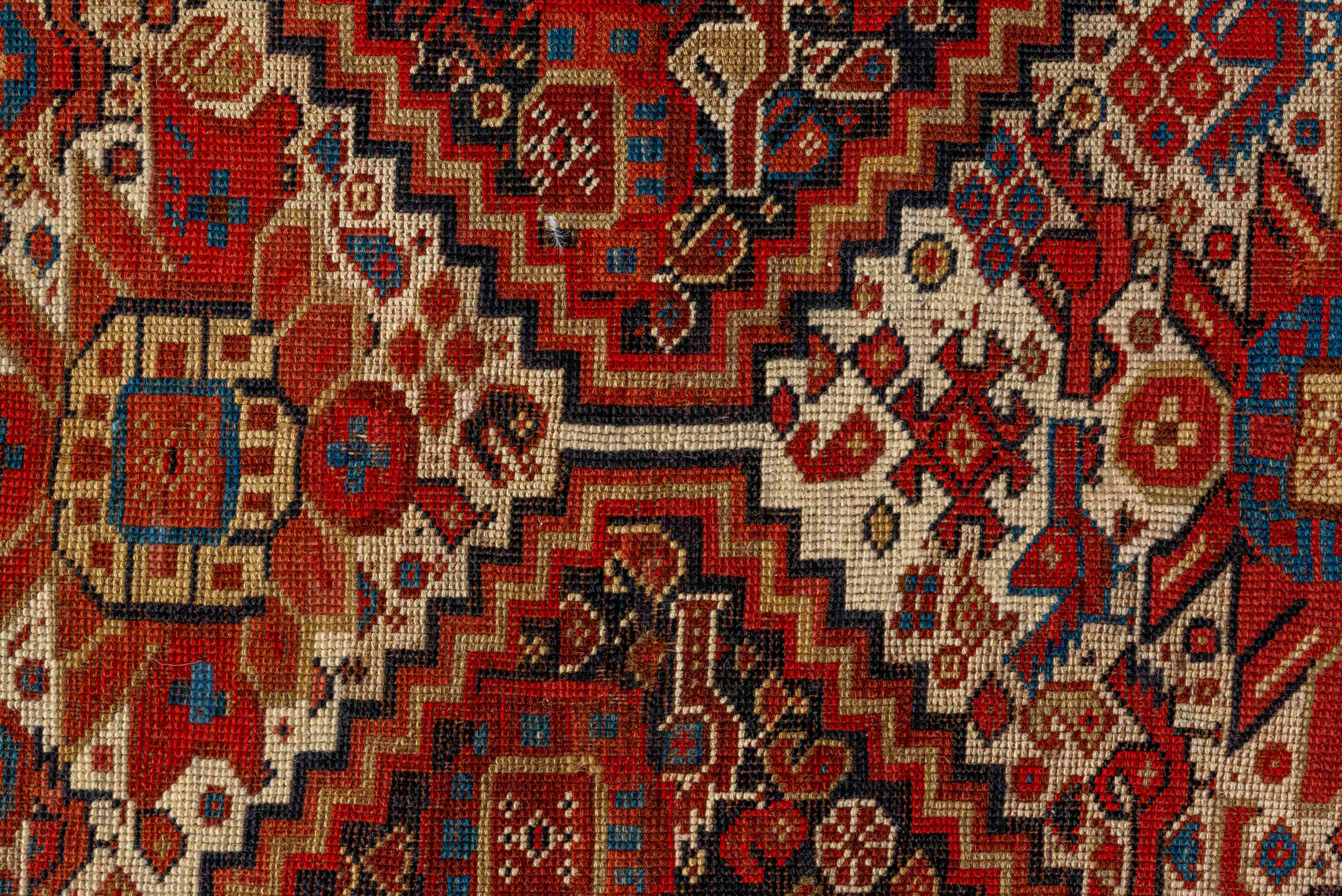 7' x 9' one-of-a-kind handmade vintage Tulu large size rug. Color palette: rust, ivory, navy, crimson, camel, charcoal