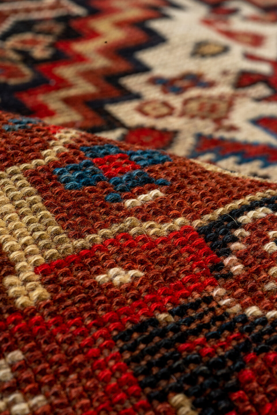 7' x 9' one-of-a-kind handmade vintage Tulu large size rug. Color palette: rust, ivory, navy, crimson, camel, charcoal