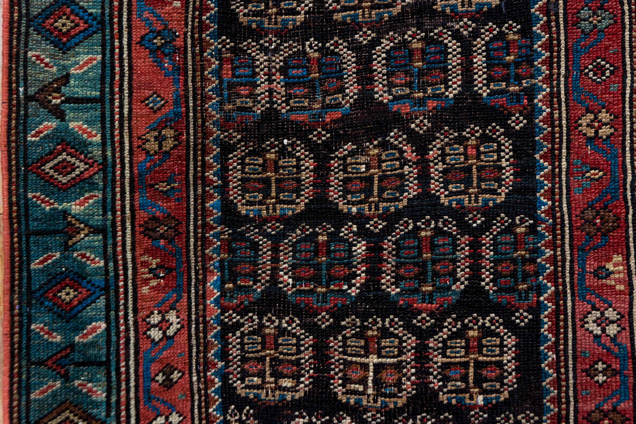 2' x 12' one-of-a-kind handmade antique Caucasian runner rug. Color palette: navy, rust, slate, ivory, rose, teal, charcoal