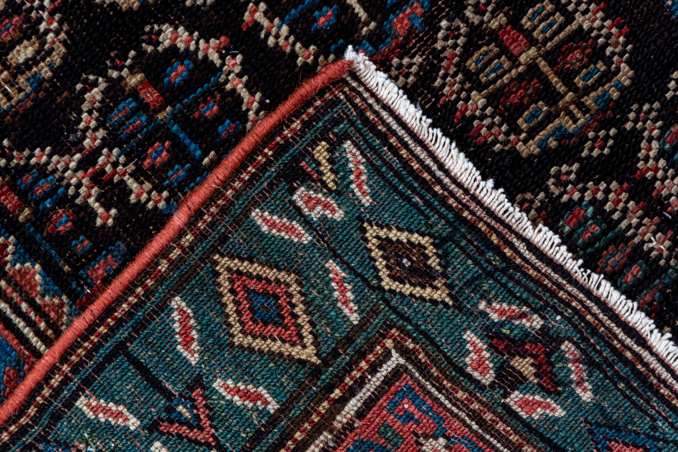 2' x 12' one-of-a-kind handmade antique Caucasian runner rug. Color palette: navy, rust, slate, ivory, rose, teal, charcoal
