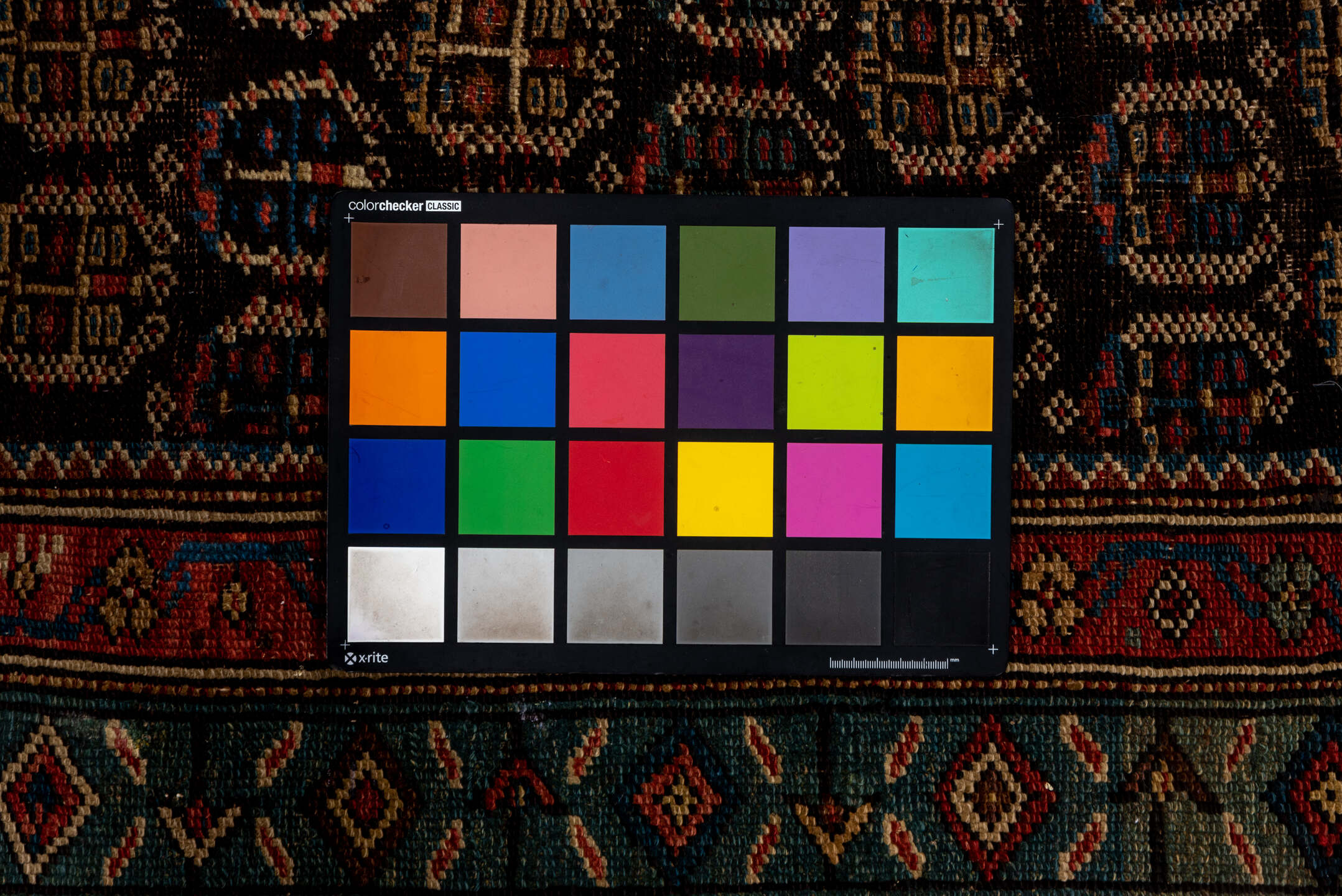 2' x 12' one-of-a-kind handmade vintage Caucasian runner rug. Color palette: black, brown, charcoal, gray, off-white, pink