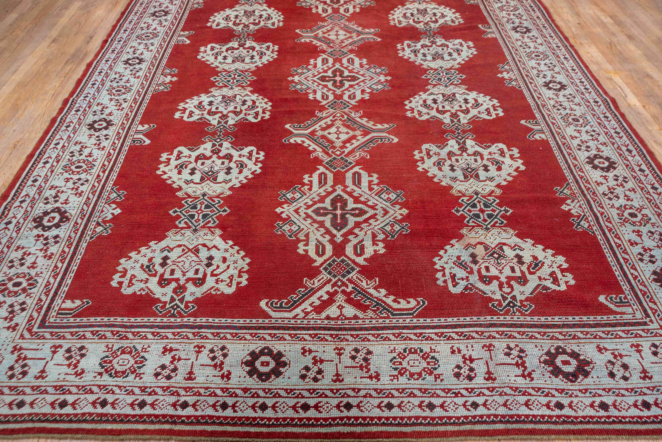 3' x 11' one-of-a-kind handmade vintage Tulu runner rug. Color palette: terracotta, ivory, crimson, charcoal, brown, red