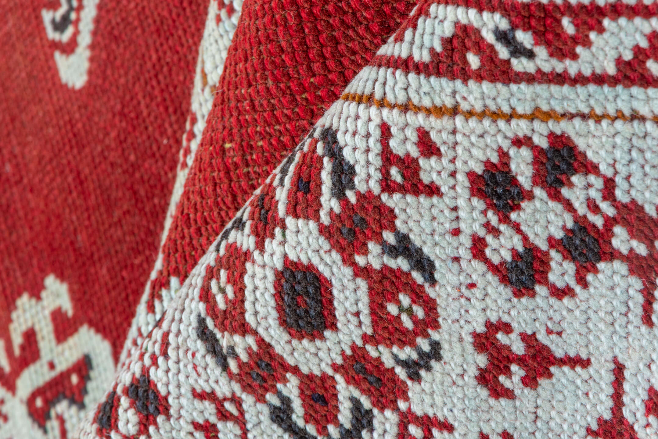3' x 11' one-of-a-kind handmade vintage Tulu runner rug. Color palette: terracotta, ivory, crimson, charcoal, brown, red