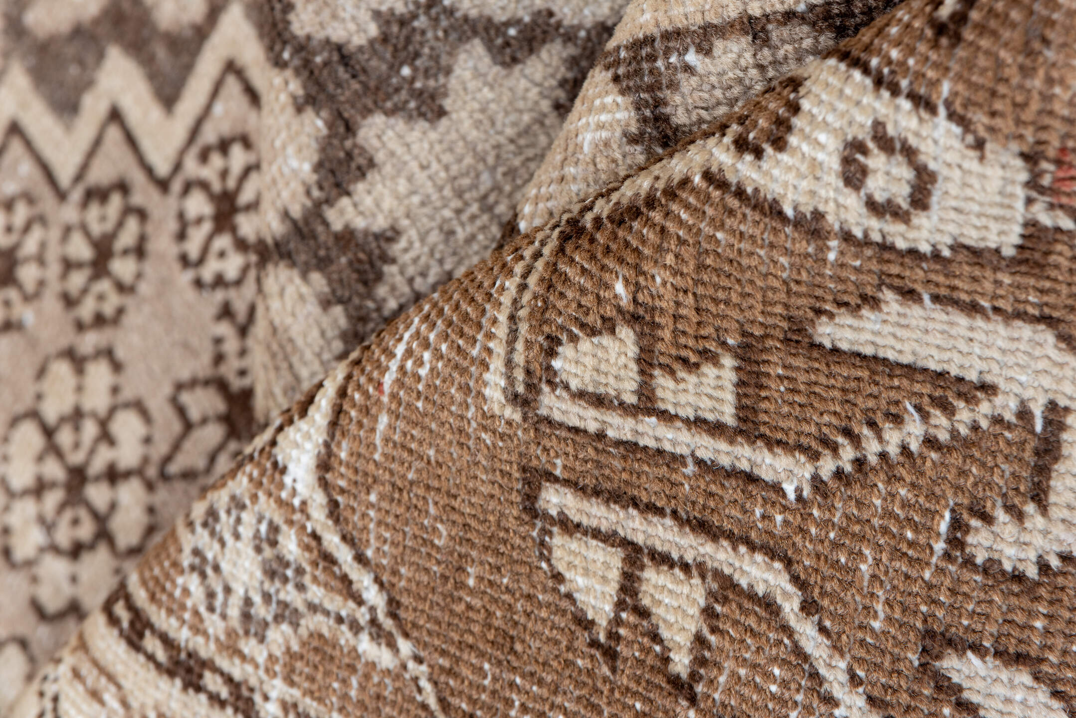 5' x 8' one-of-a-kind handmade vintage Khotan medium size rug. Color palette: brown, gray, light gray, off-white, orange