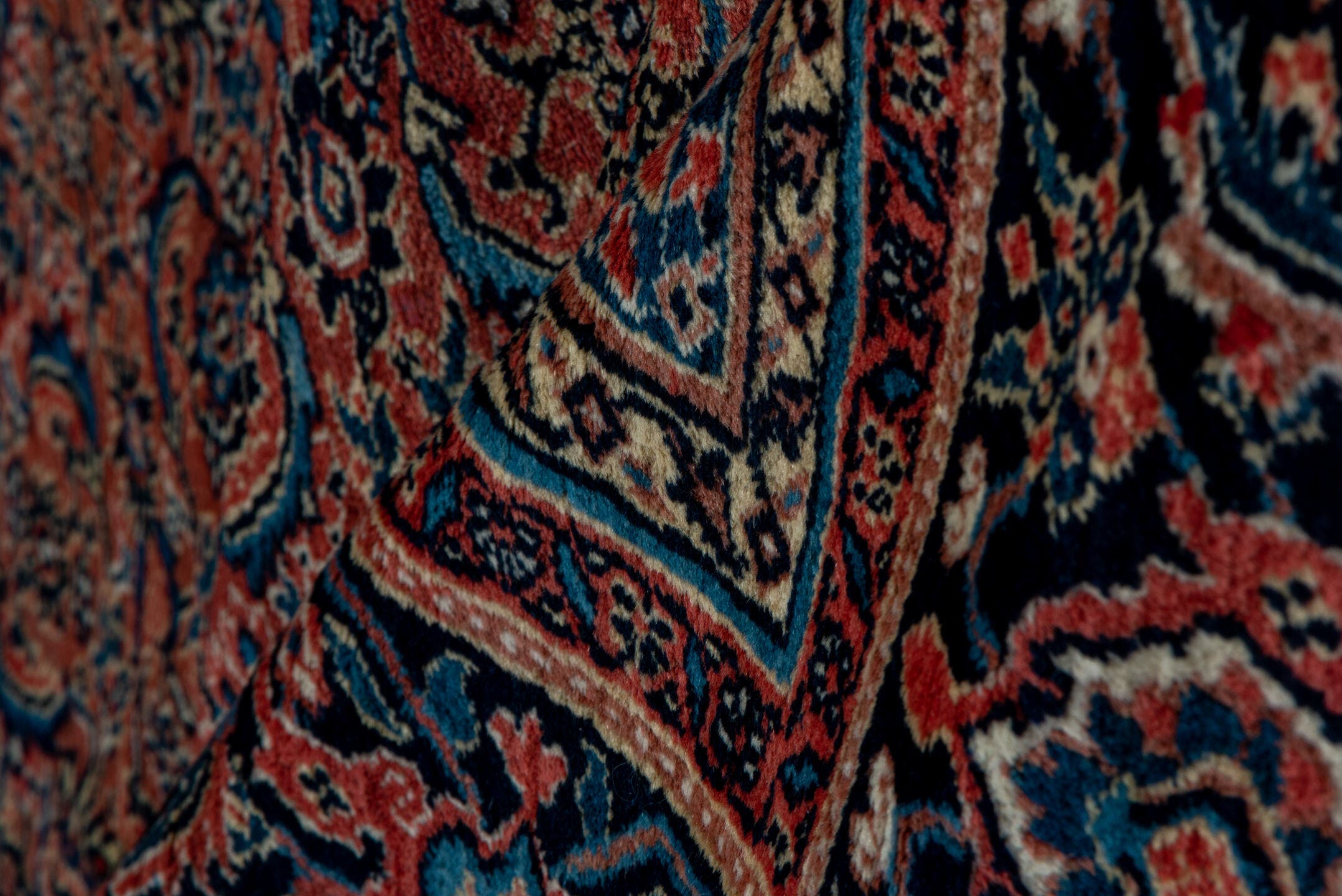 7' x 16' one-of-a-kind handmade antique Karabagh rug. Color palette: rose, navy, terracotta, dusty blue, ivory, rust, slate