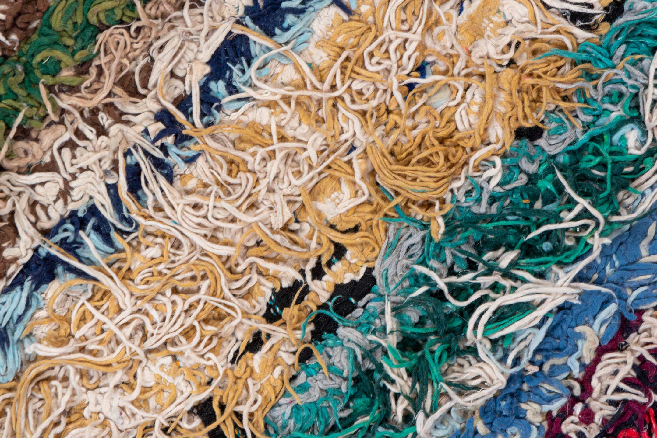4' x 10' one-of-a-kind handmade vintage Rag Rug runner rug. Color palette: ivory, burgundy, teal, tan, blue, cream, red