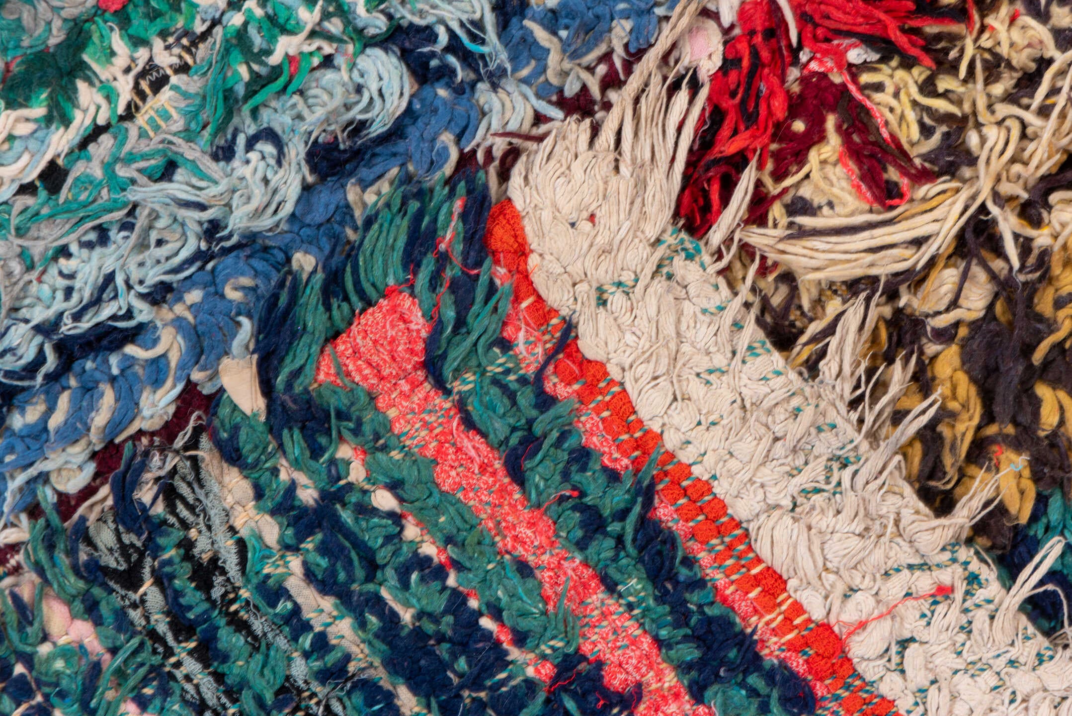 4' x 10' one-of-a-kind handmade vintage Rag Rug runner rug. Color palette: ivory, burgundy, teal, tan, blue, cream, red