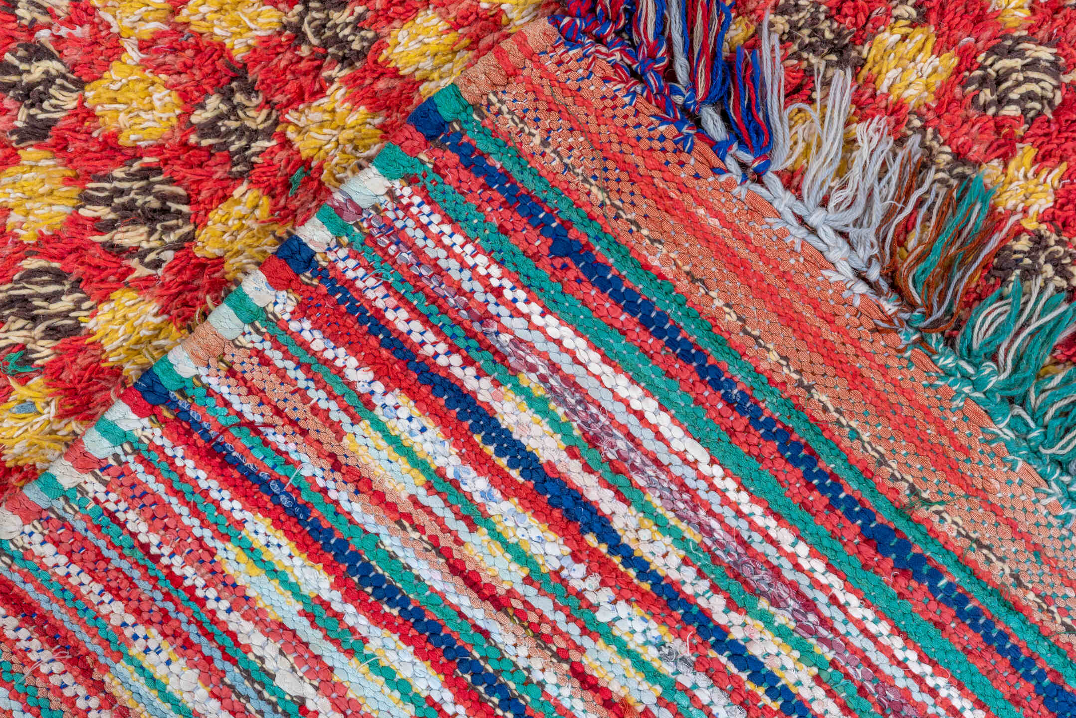 5' x 7' one-of-a-kind handmade vintage Rag Rug rug. Color palette: red, gold, dark brown, rust, blue, teal, ivory, brown
