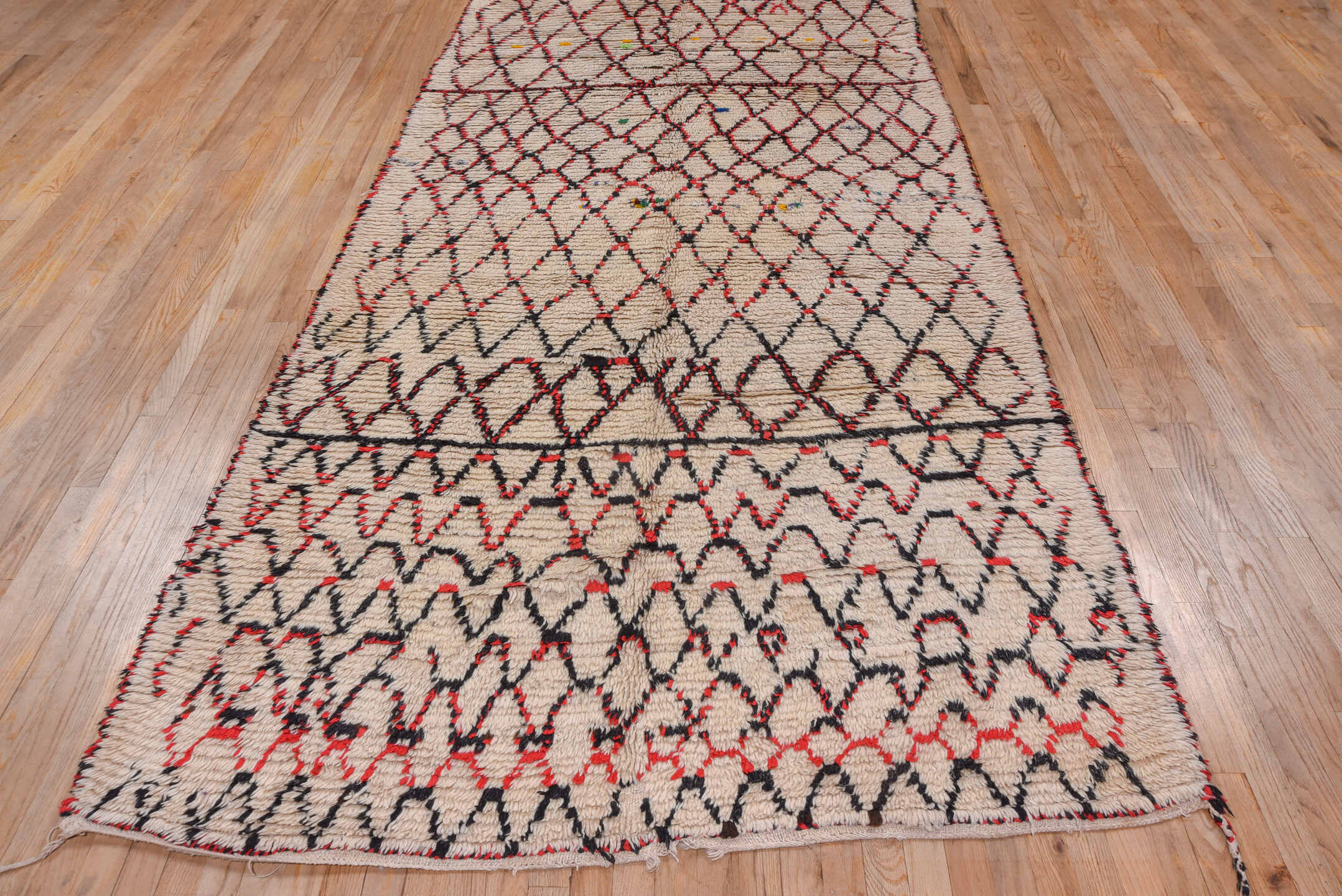 5' x 11' one-of-a-kind handmade vintage Moroccan rug. Color palette: ivory, black, red, coral, gold, blue, green, terracotta