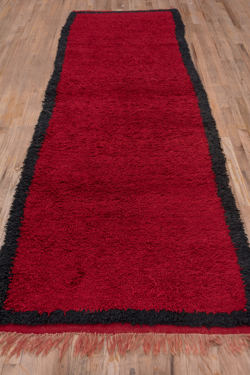 3' x 10' one-of-a-kind handmade vintage Moroccan runner rug. Color palette: black, brown, crimson, gray, off-white, pink