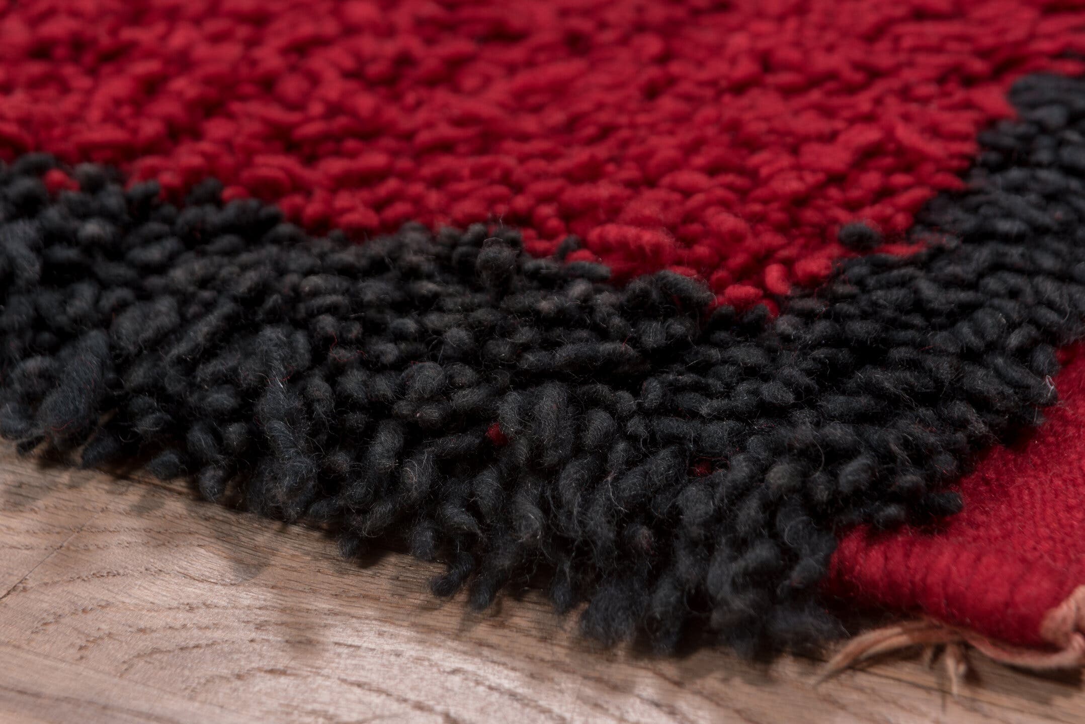 3' x 10' one-of-a-kind handmade vintage Moroccan runner rug. Color palette: crimson, black, mahogany, red, brown