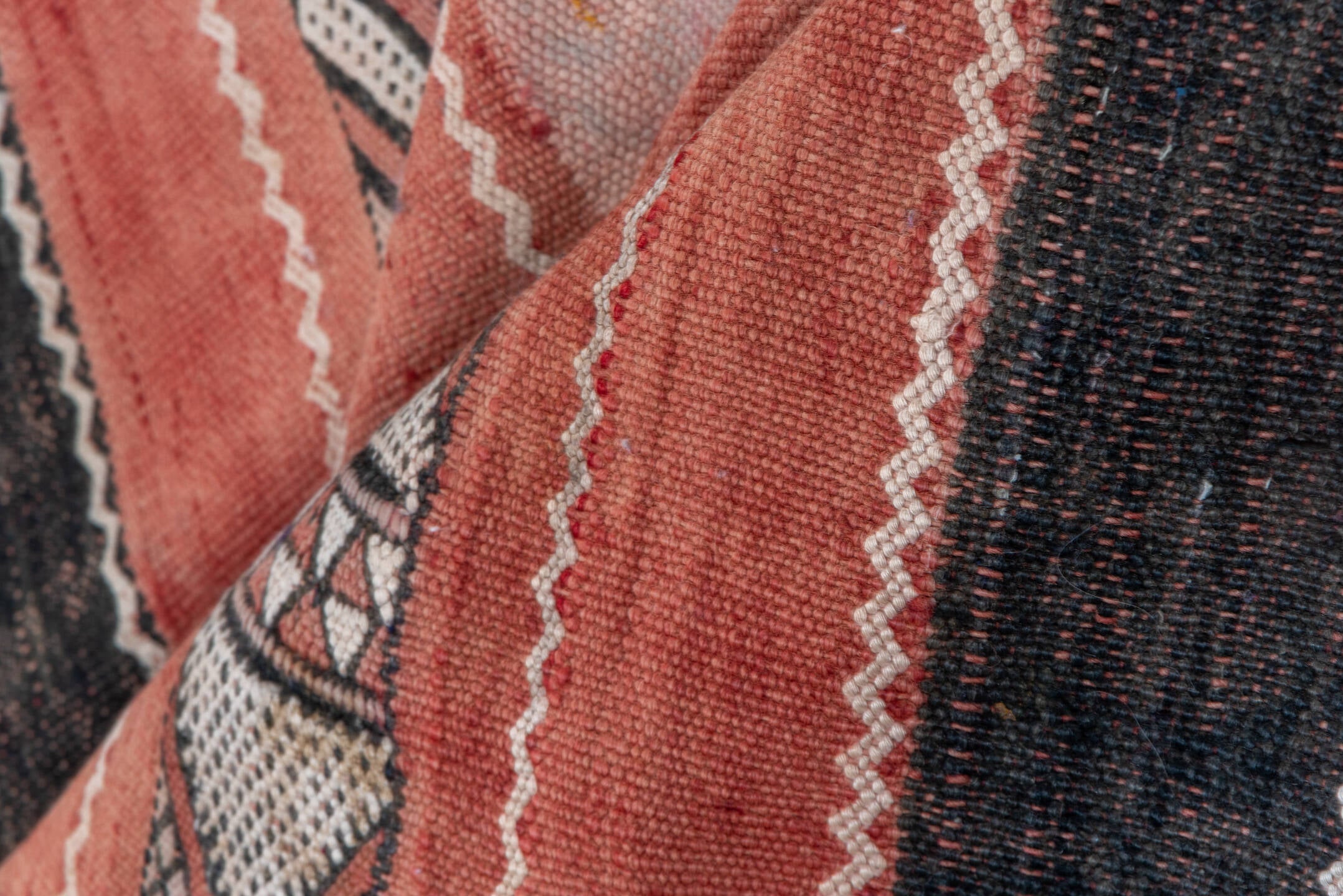 5' x 8' one-of-a-kind handmade vintage Jijim medium size rug. Color palette: black, brown, gray, light gray, orange, pink