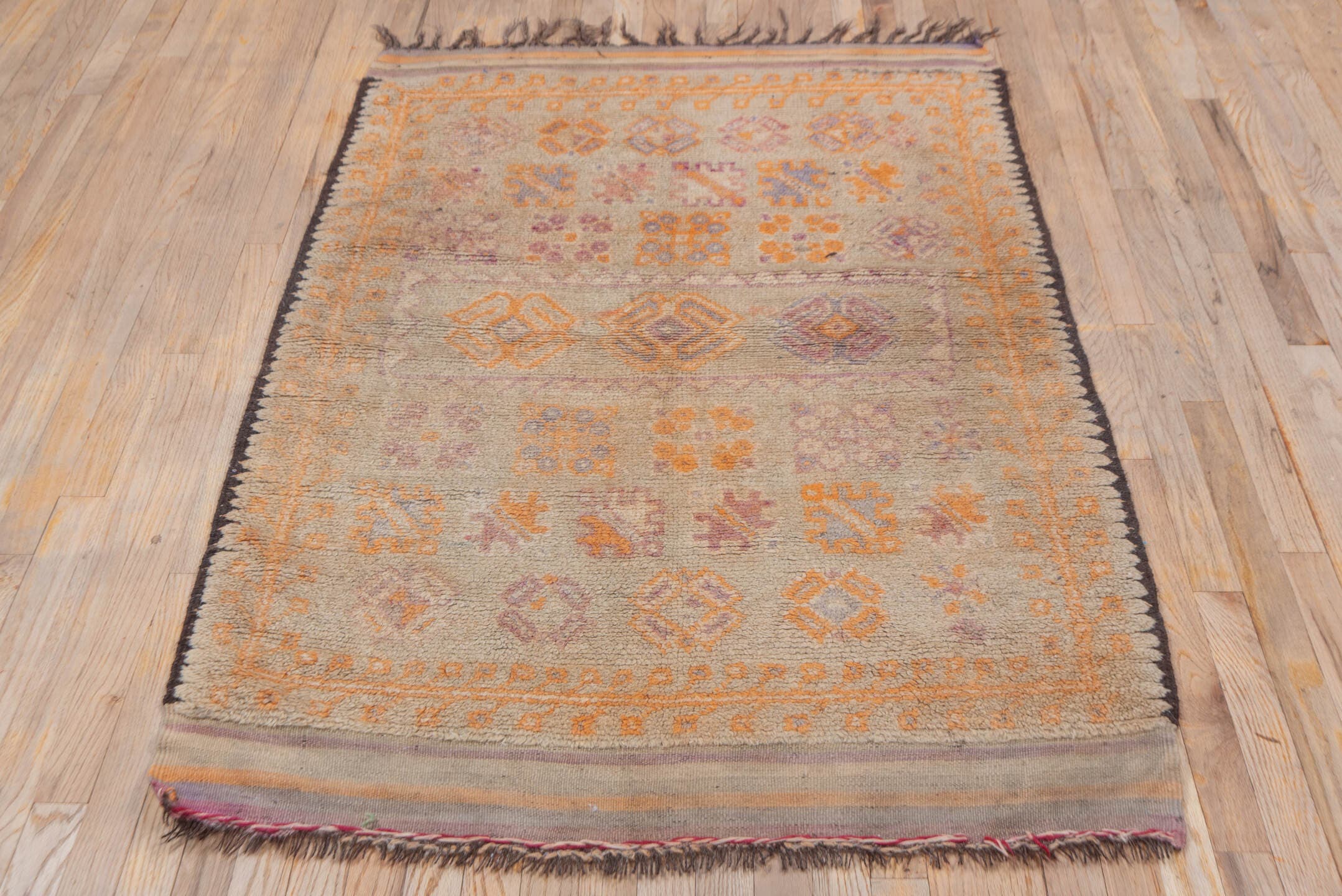 3' x 5' one-of-a-kind handmade vintage Moroccan small size rug. Color palette: ivory, saffron, taupe, rose, lavender, brown