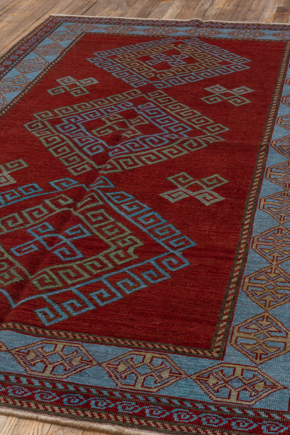 4' x 6' one-of-a-kind handmade vintage Caucasian small size rug. Color palette: red, ivory, sky blue, rust, burgundy, camel