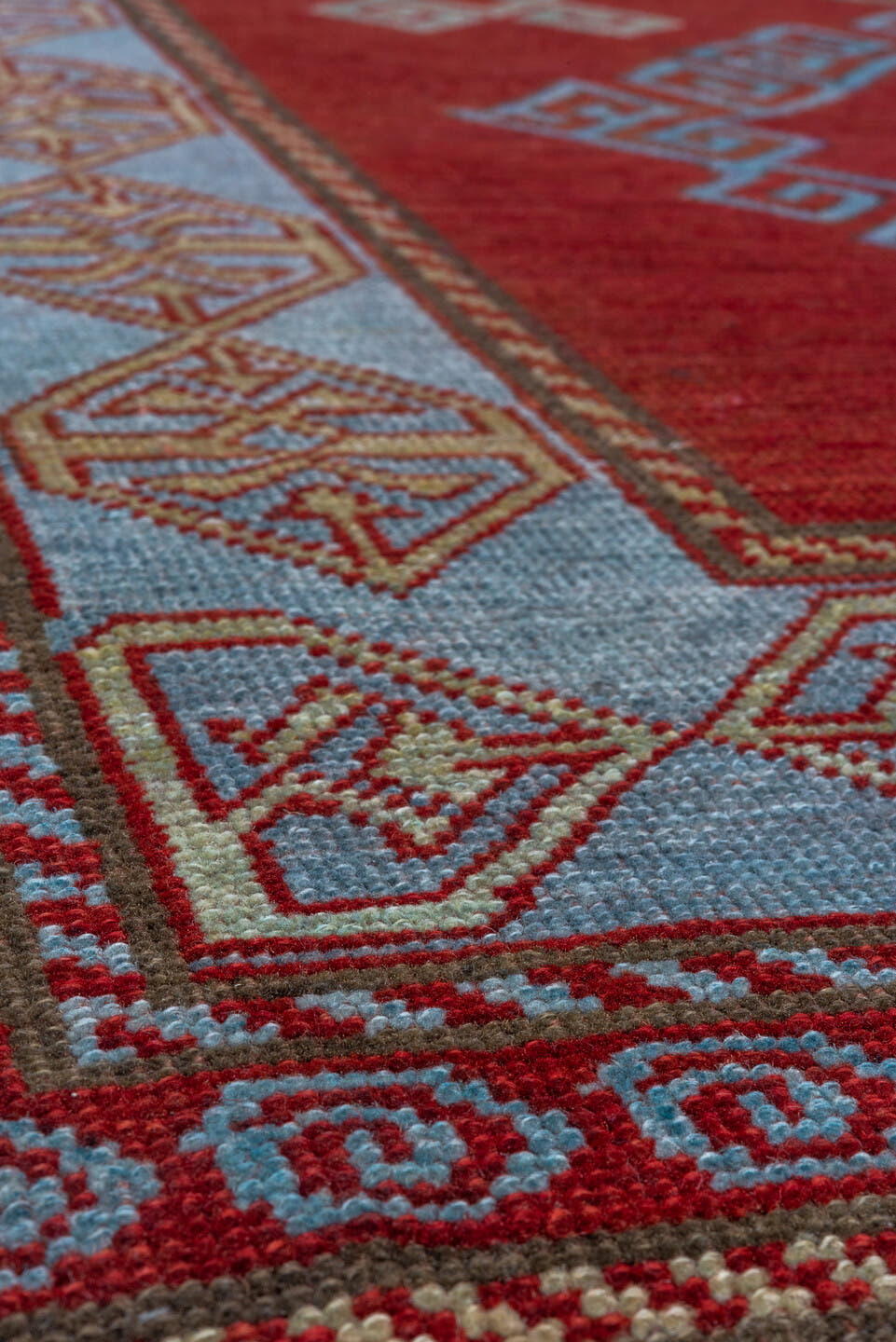 4' x 6' one-of-a-kind handmade vintage Caucasian small size rug. Color palette: red, ivory, sky blue, rust, burgundy, camel