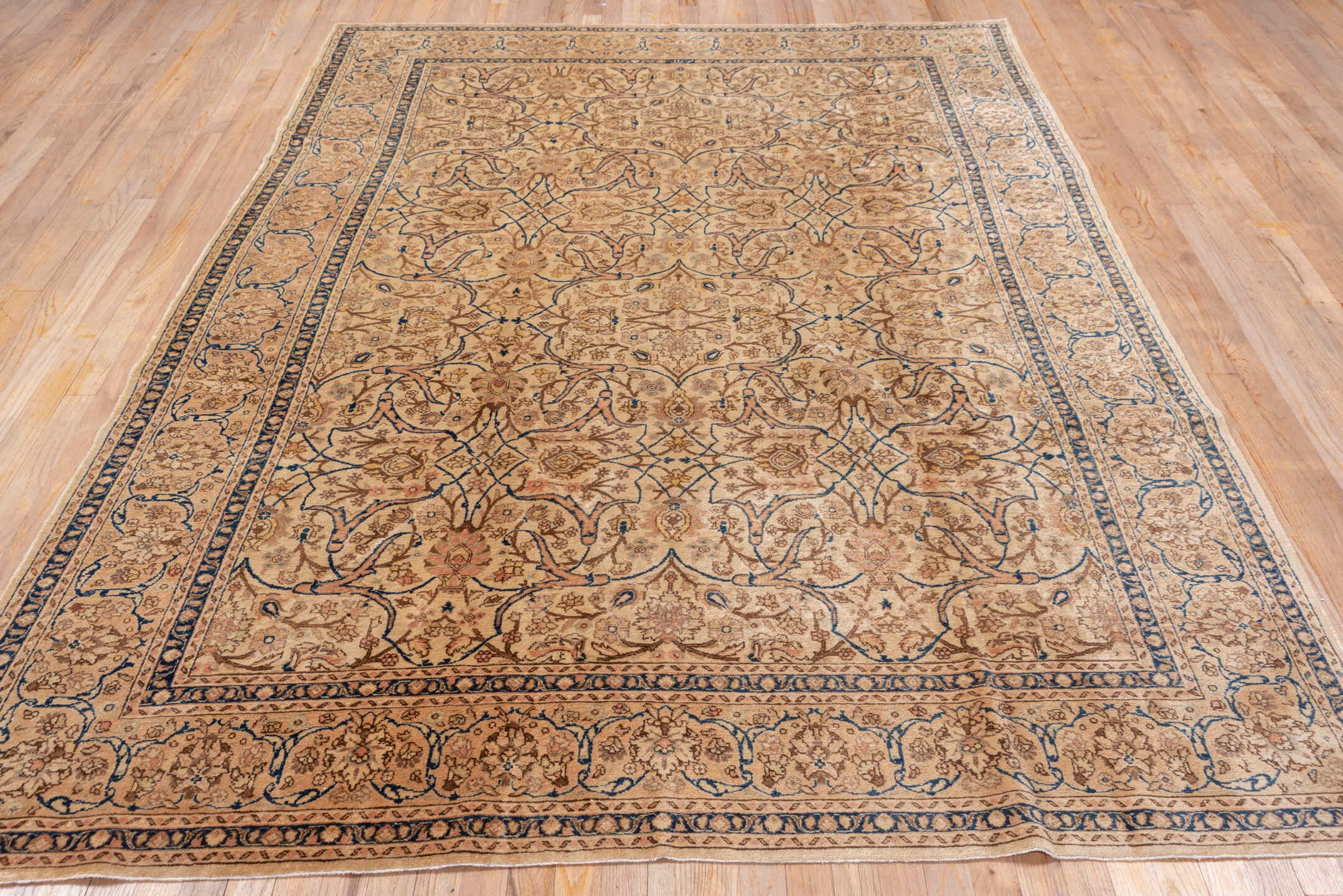 6' x 9' one-of-a-kind handmade antique Tabriz medium size rug. Color palette: ivory, camel, taupe, navy, beige, brown