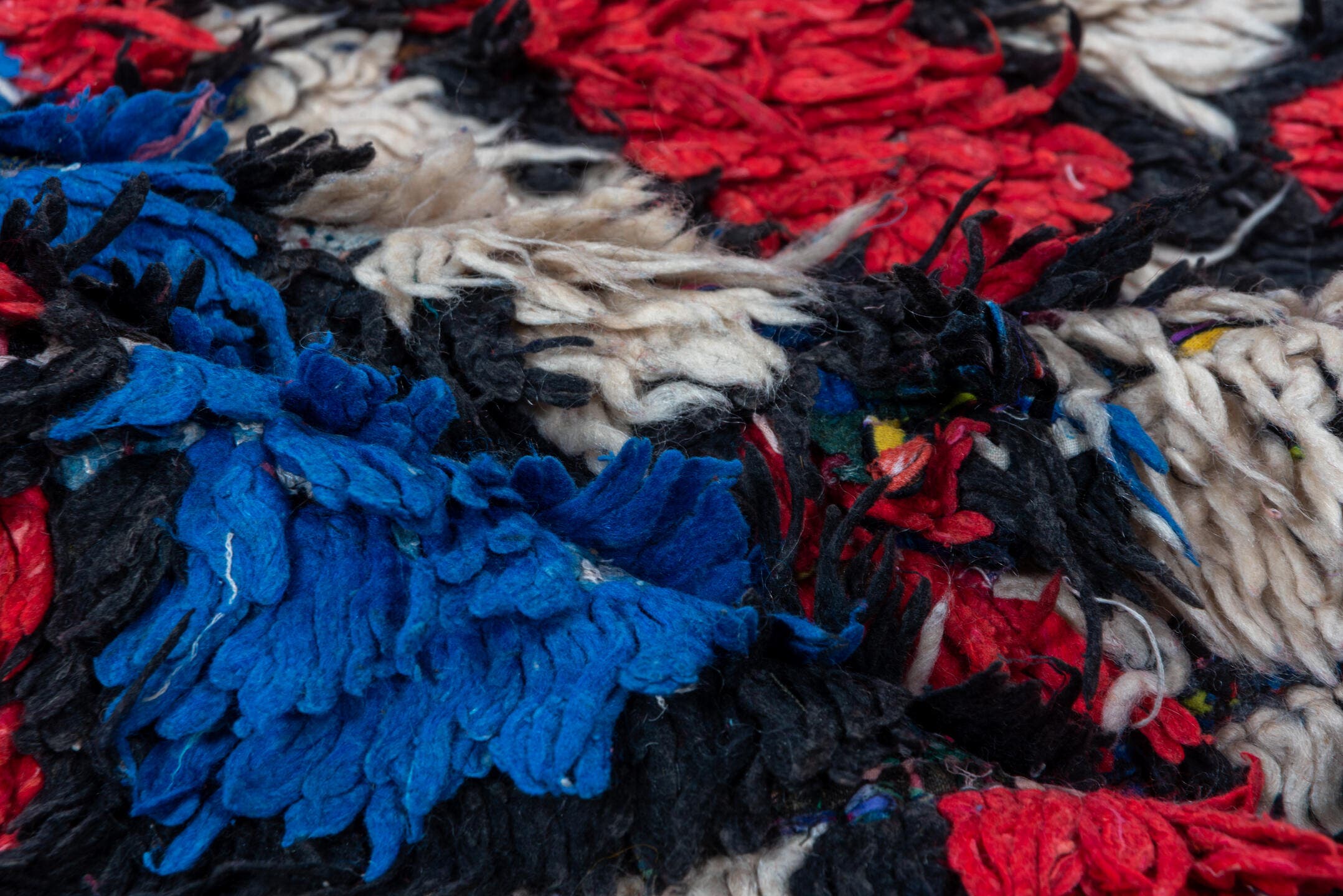 4' x 10' one-of-a-kind handmade vintage Moroccan runner rug. Color palette: ivory, cobalt, crimson, black, blue, red