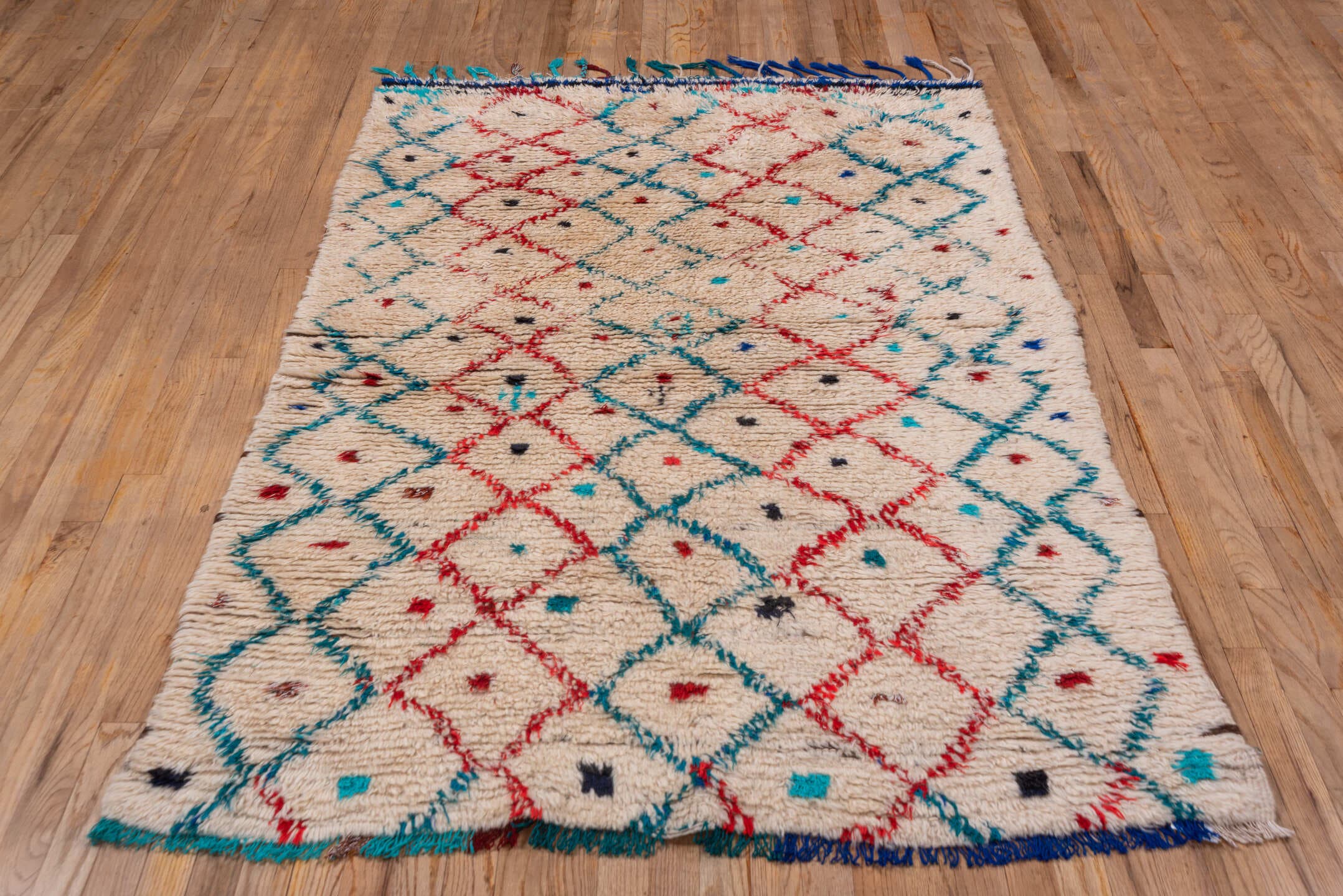 4' x 6' one-of-a-kind handmade vintage Moroccan small size rug. Color palette: ivory, turquoise, red, navy, black, teal
