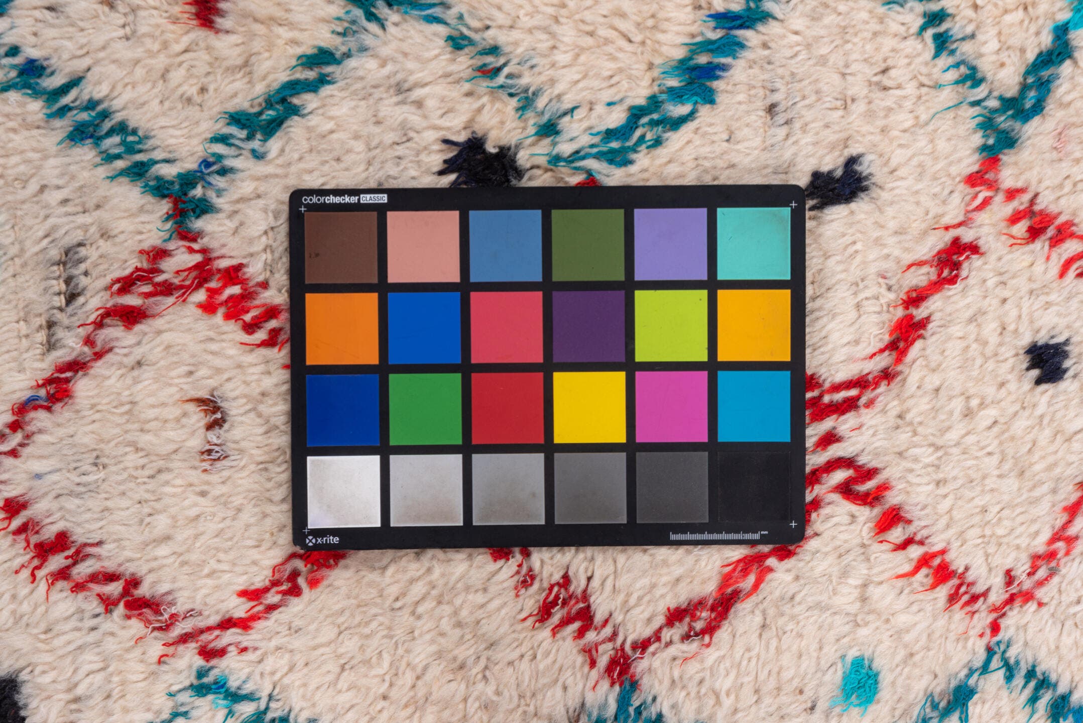 4' x 6' one-of-a-kind handmade vintage Moroccan small size rug. Color palette: ivory, turquoise, red, navy, black, teal