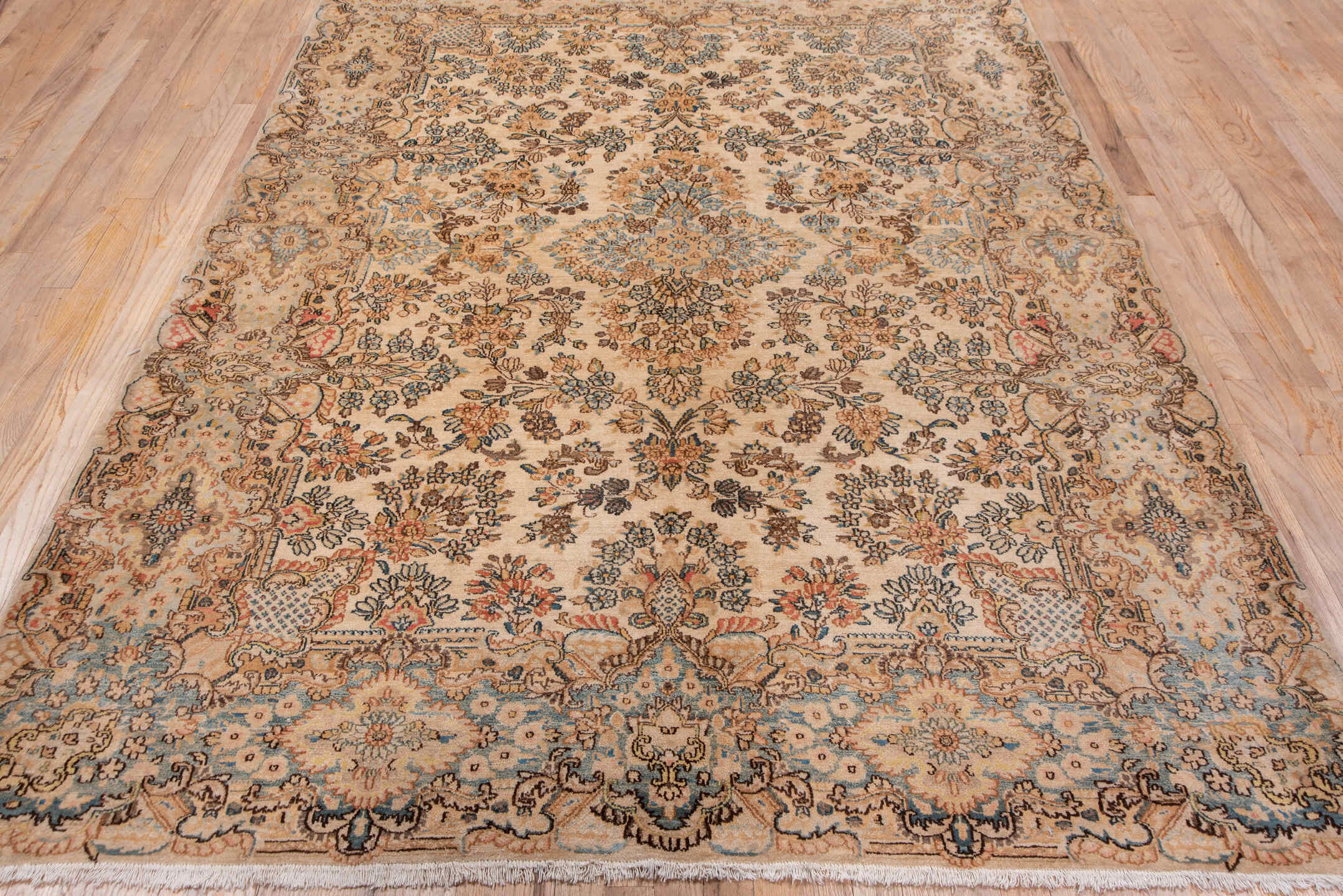 6' x 8' one-of-a-kind handmade antique Kerman medium size rug. Color palette: ivory, camel, sky blue, taupe, brown, blush