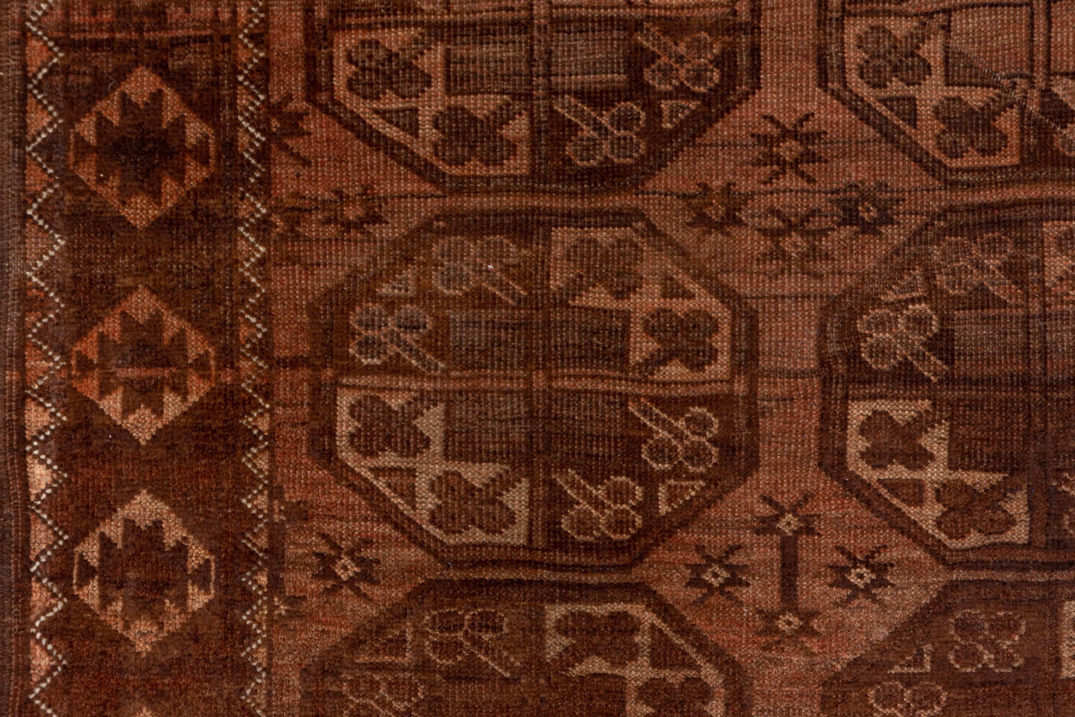 4' x 7' one-of-a-kind handmade antique Afghan rug. Color palette: brown, rust, camel, mahogany, taupe, terra cotta, charcoal