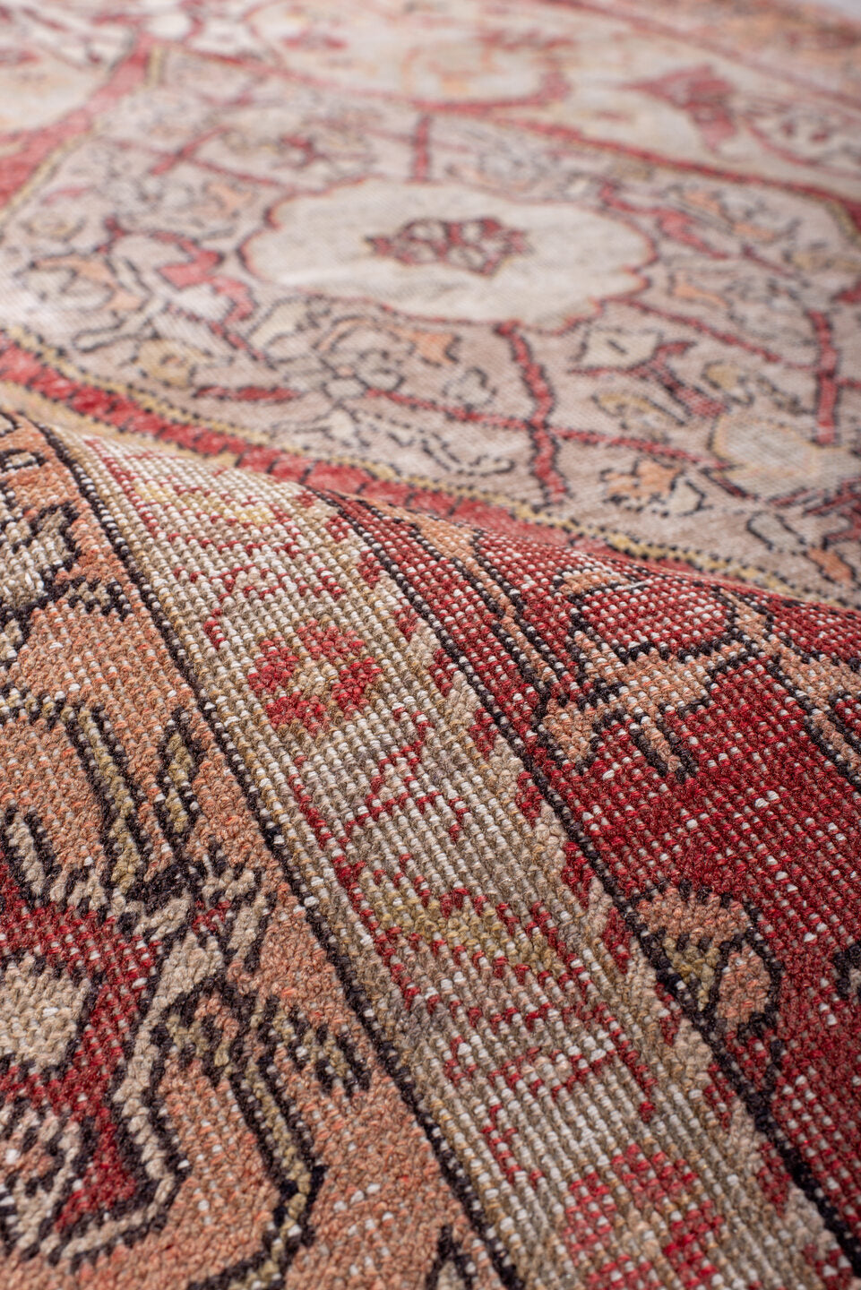 4' x 7' one-of-a-kind handmade vintage Oushak rug. Color palette: black, brown, gray, light gray, pink, red, redwood, wine