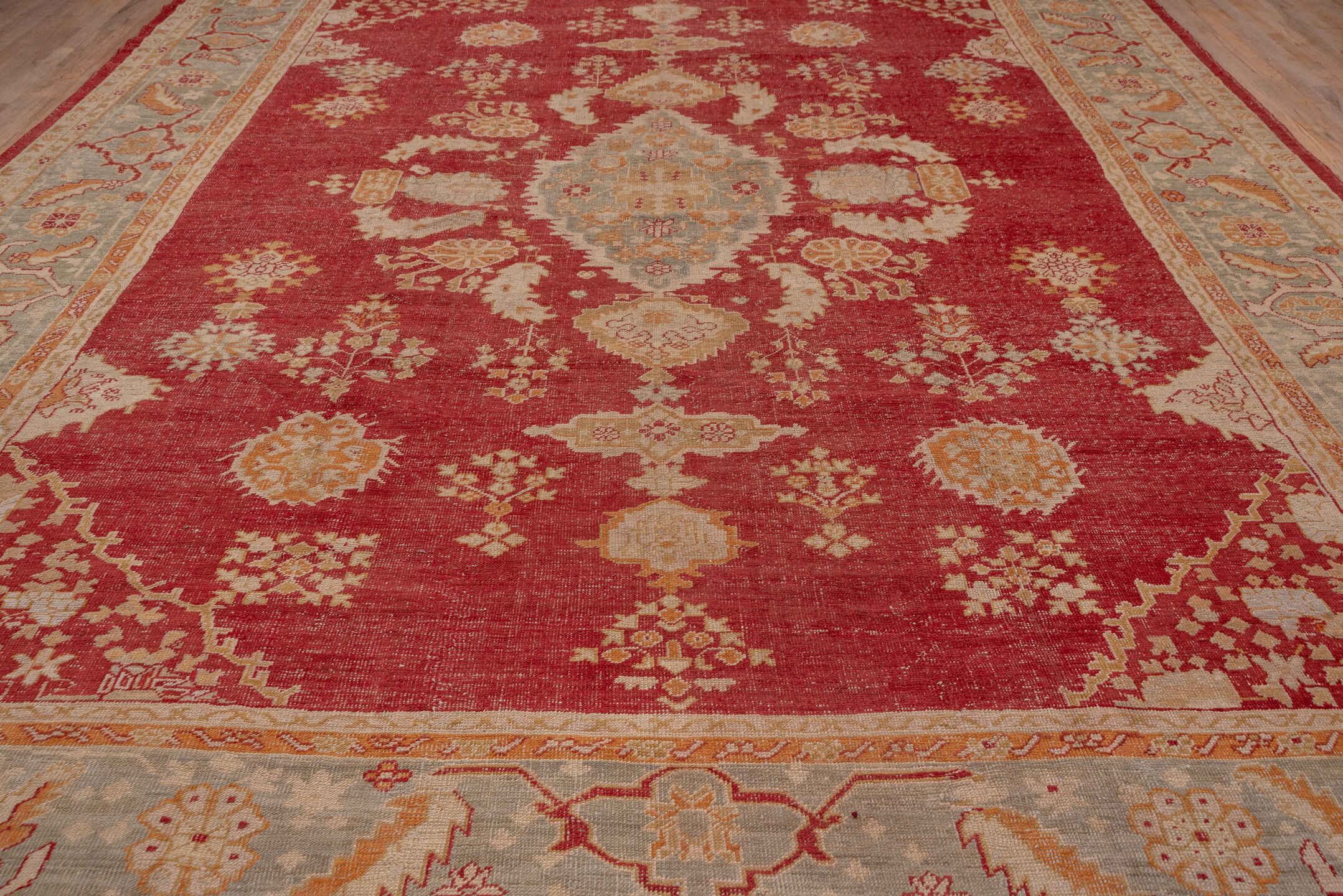 12' x 15' one-of-a-kind handmade antique Oushak oversize rug. Color palette: terracotta, pale blue, ivory, camel, rust, gold
