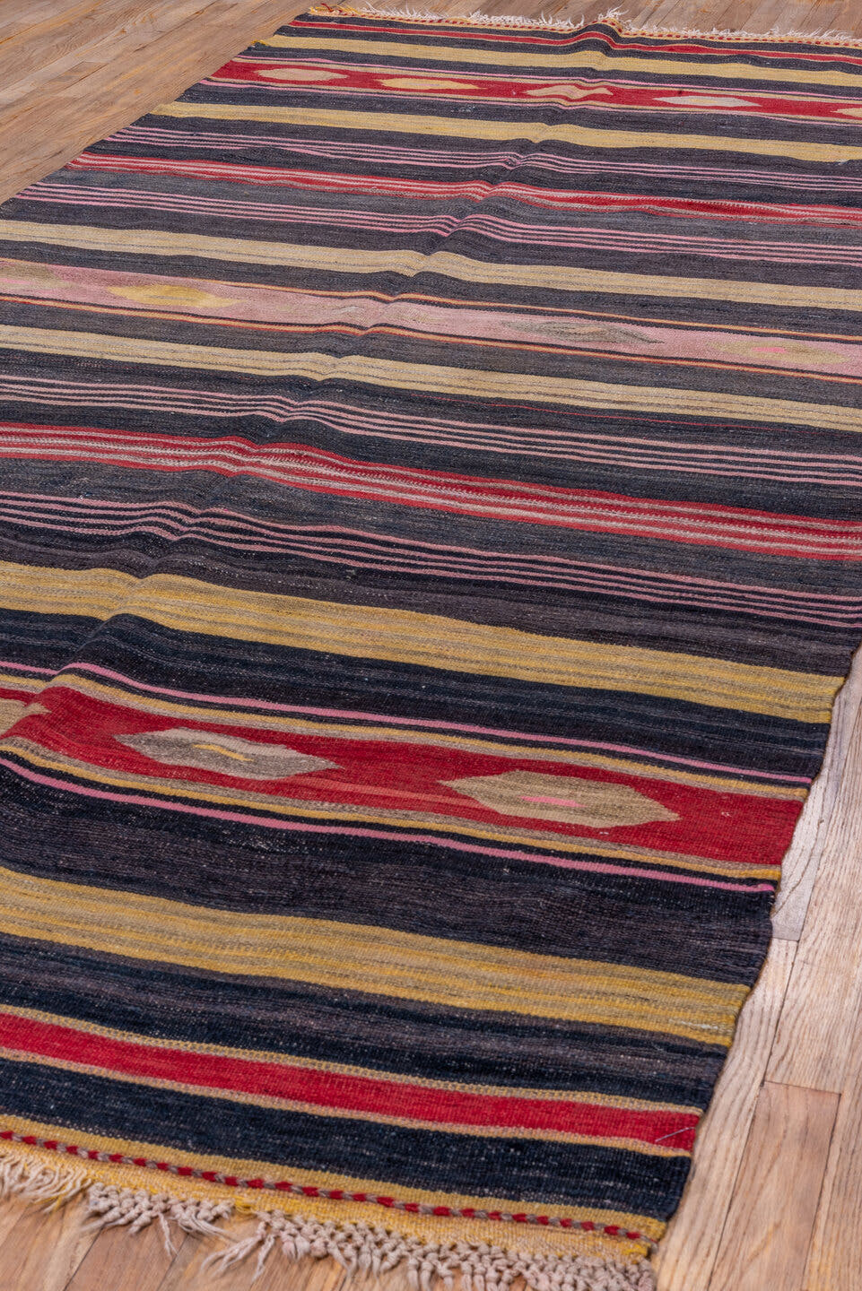 4' x 11' one-of-a-kind handmade vintage Kilim runner rug. Color palette: charcoal, rust, camel, rose, taupe, burgundy, gray