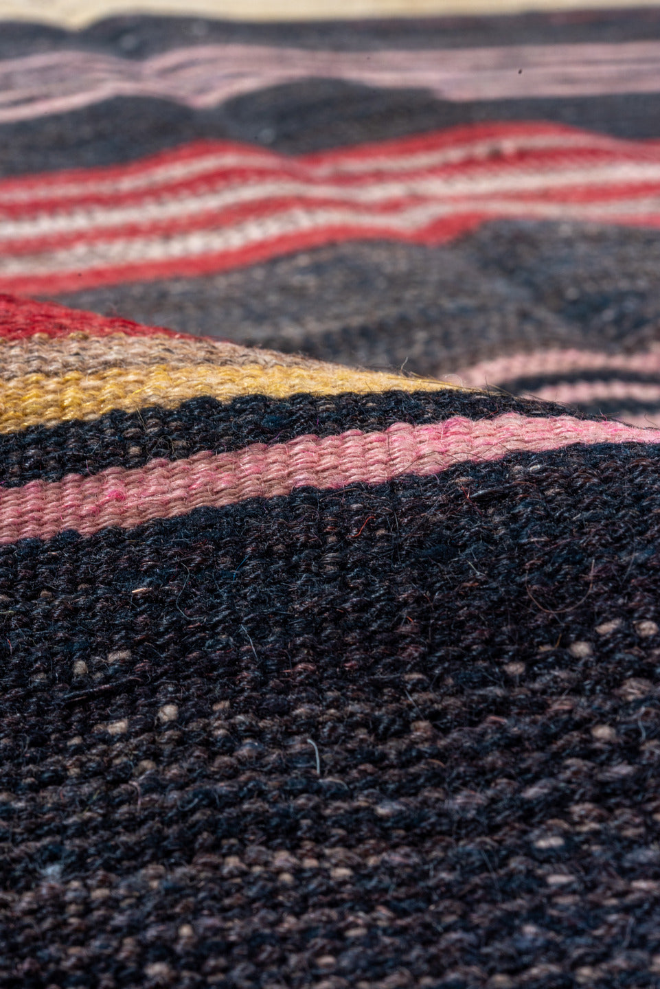 4' x 11' one-of-a-kind handmade vintage Kilim runner rug. Color palette: black, brown, charcoal, gray, pink, red