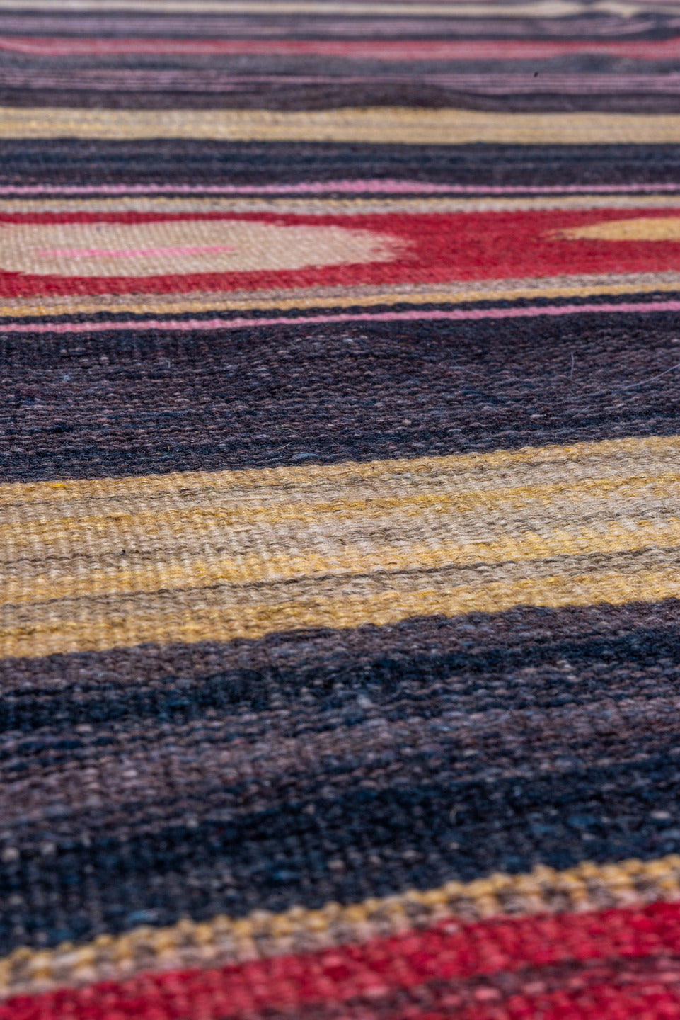4' x 11' one-of-a-kind handmade vintage Kilim runner rug. Color palette: black, brown, charcoal, gray, pink, red