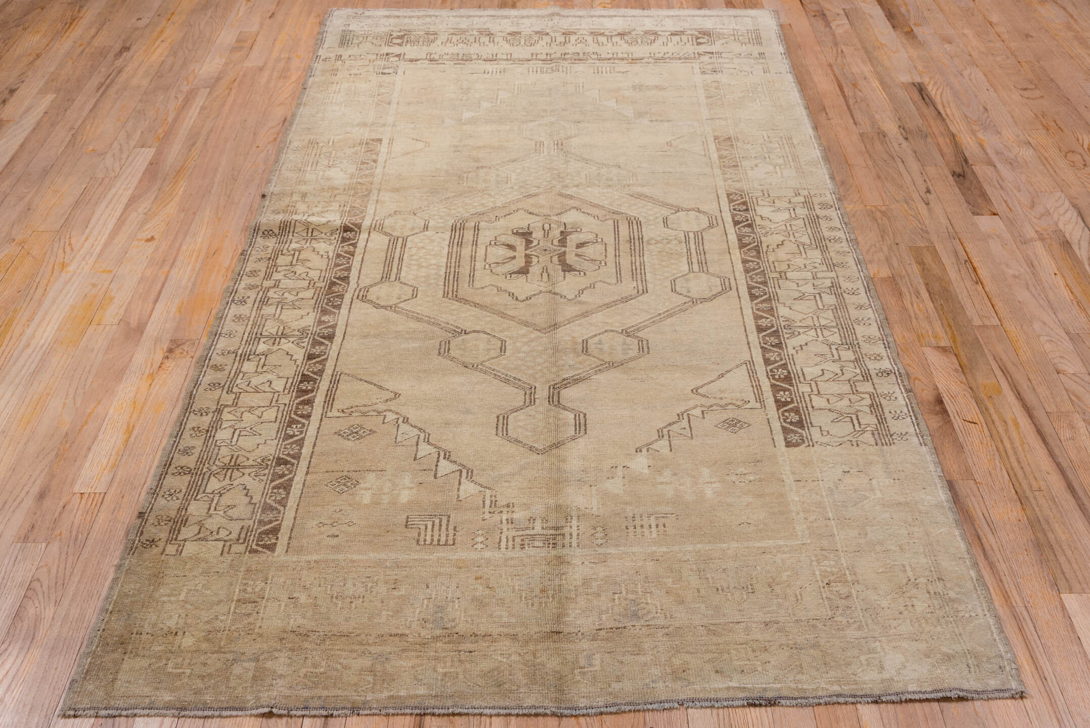 4' x 8' one-of-a-kind handmade vintage Oushak rug. Color palette: taupe, beige, camel, brown, ivory, gray