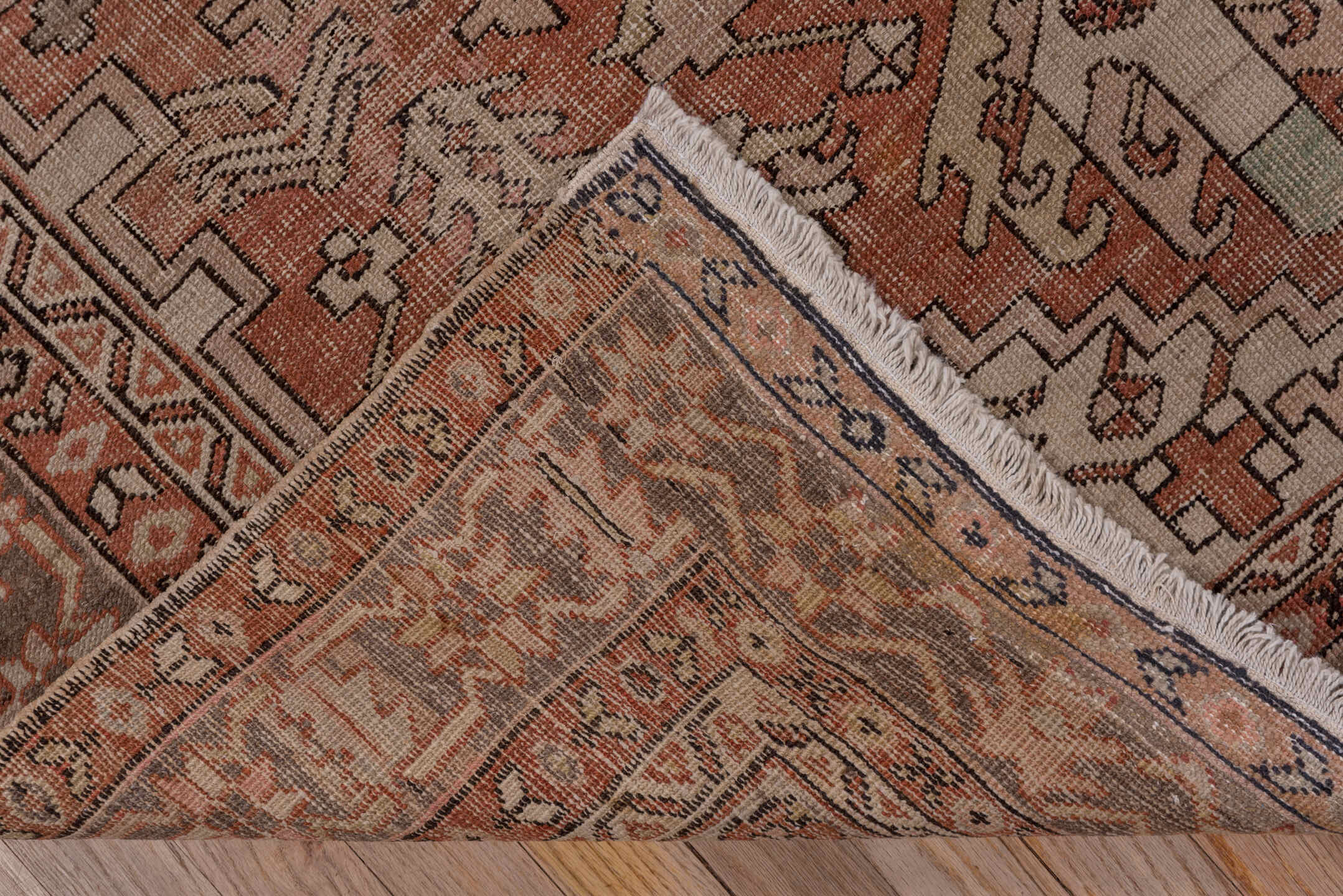 4' x 5' one-of-a-kind handmade antique Serapi small size rug. Color palette: terra cotta, taupe, brown, ivory, camel, slate