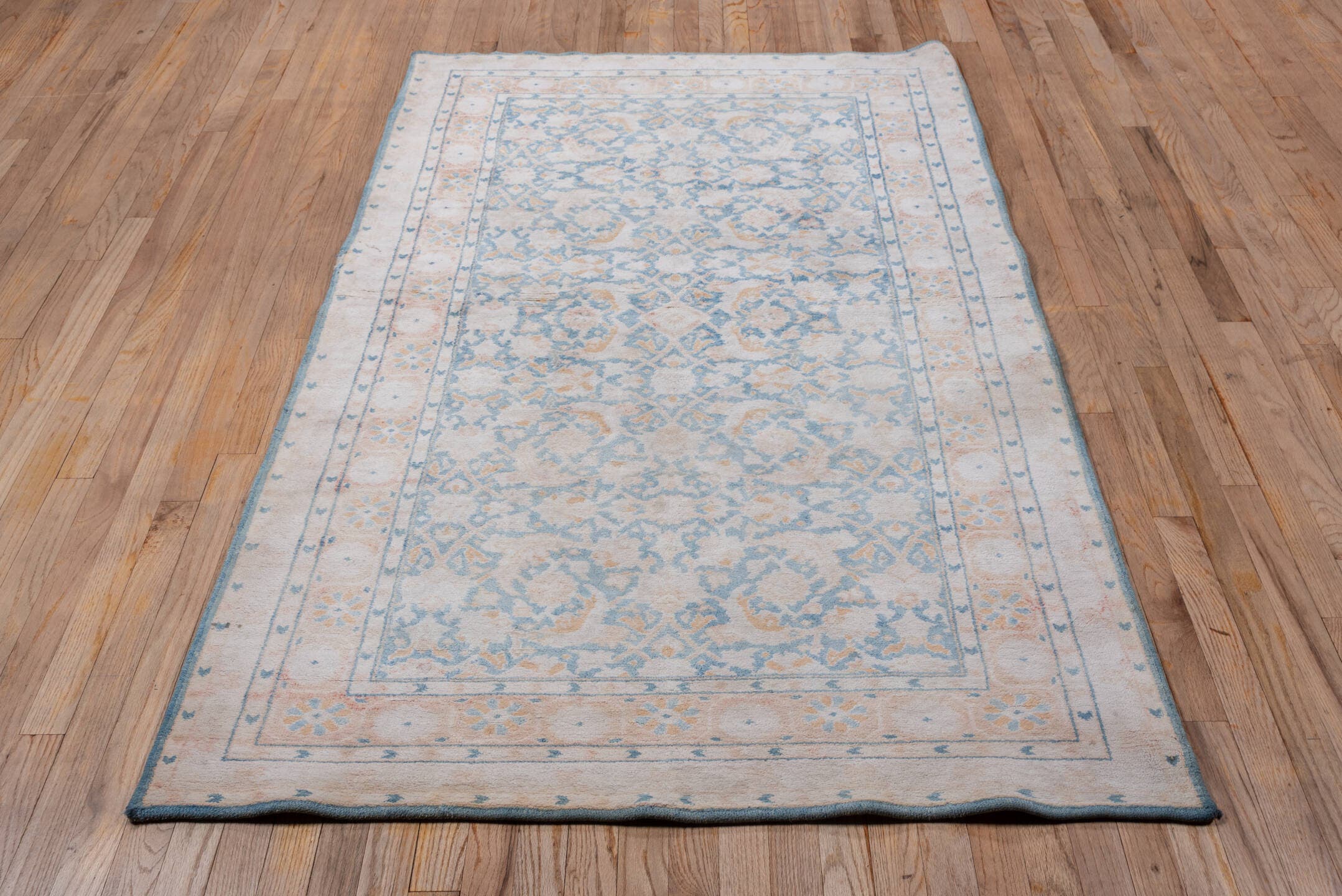 4' x 6' one-of-a-kind handmade vintage Agra small size rug. Color palette: ivory, powder_blue, blush, peach, sky_blue