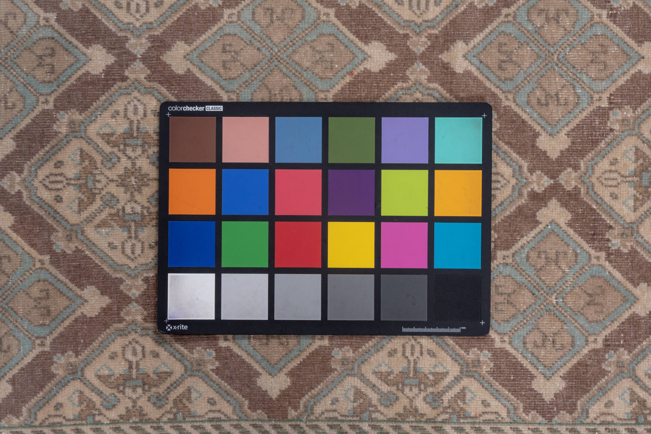 5' x 8' one-of-a-kind handmade vintage Sivas medium size rug. Color palette: brown, gray, light gray, pink