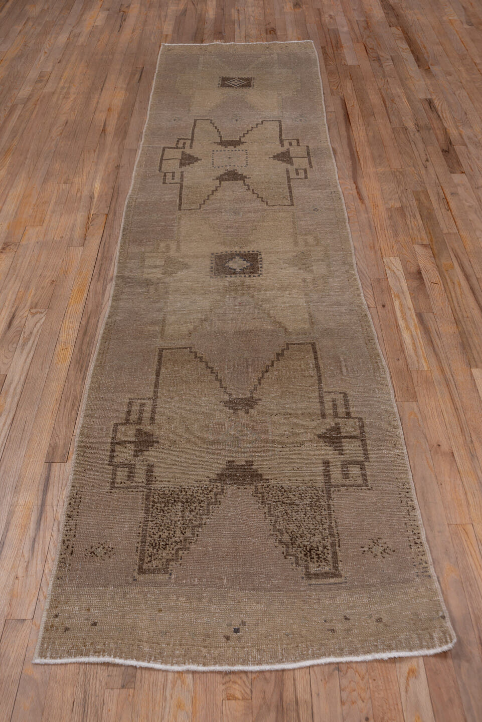 2' x 11' one-of-a-kind handmade vintage Oushak runner rug. Color palette: taupe, beige, brown, ivory, camel, gray