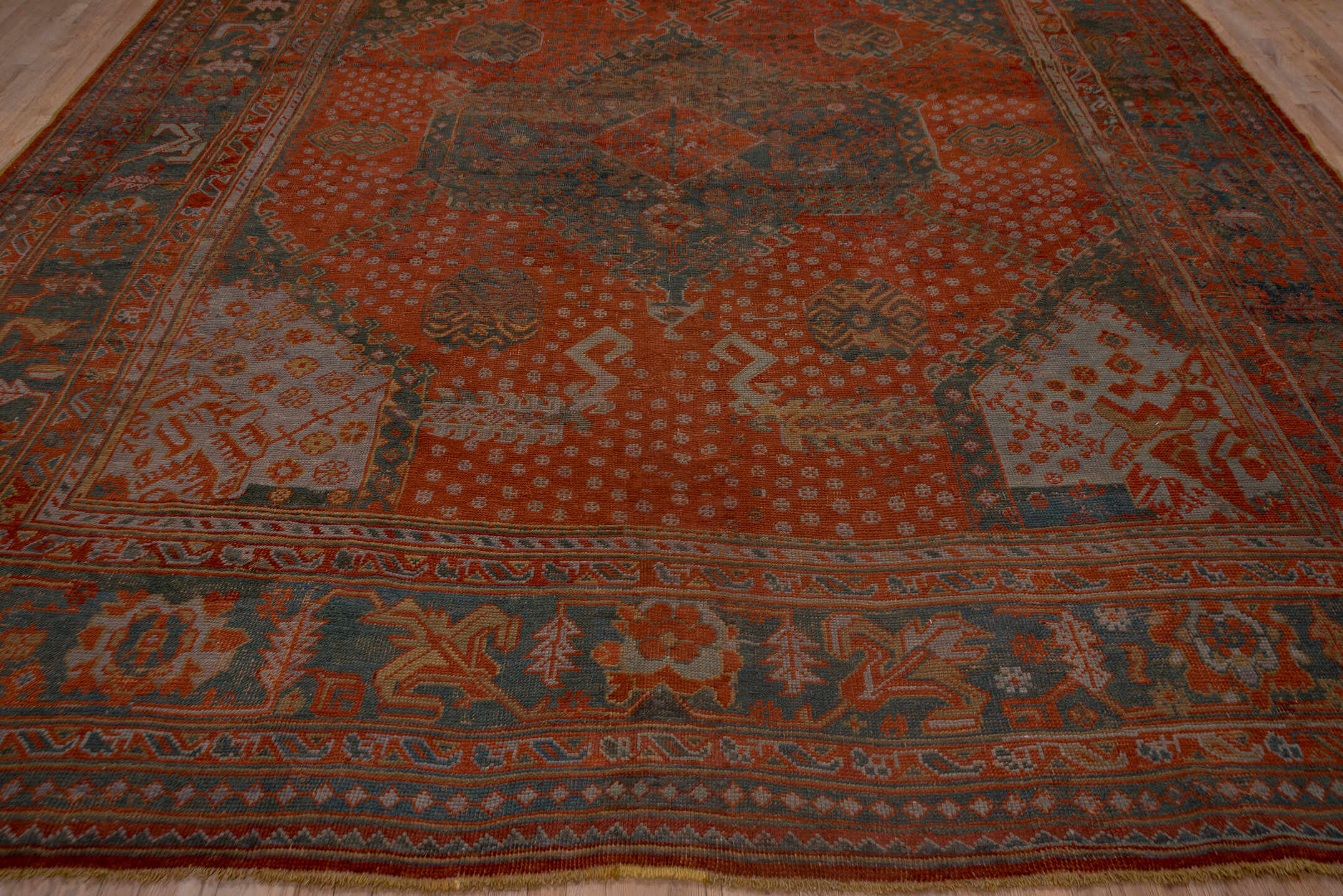 12' x 14' one-of-a-kind handmade antique Oushak oversize rug. Color palette: terra cotta, charcoal, rust, slate, ivory, rose