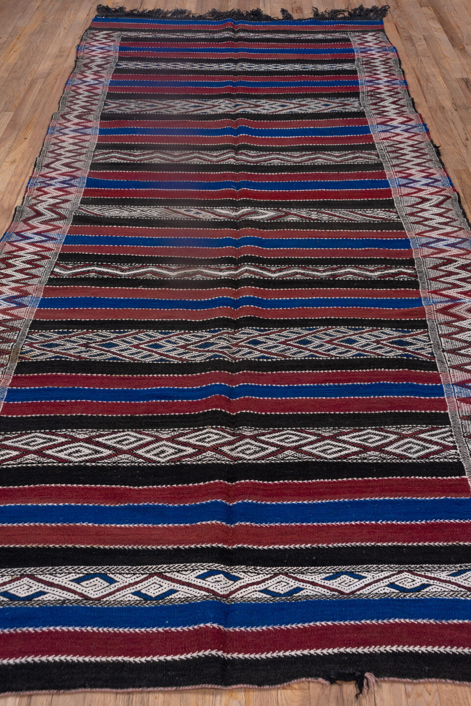 5' x 11' one-of-a-kind handmade vintage Kilim runner rug. Color palette: black, blue, brown, dark gray, gray, light gray