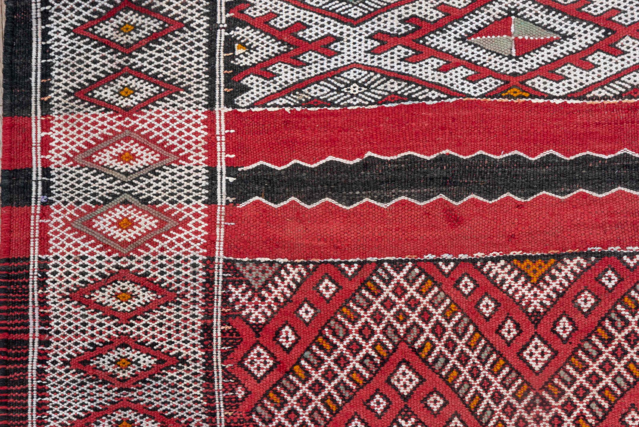 4' x 8' one-of-a-kind handmade vintage Kilim rug. Color palette: red, ivory, charcoal, rust, brown, gray, black, terracotta