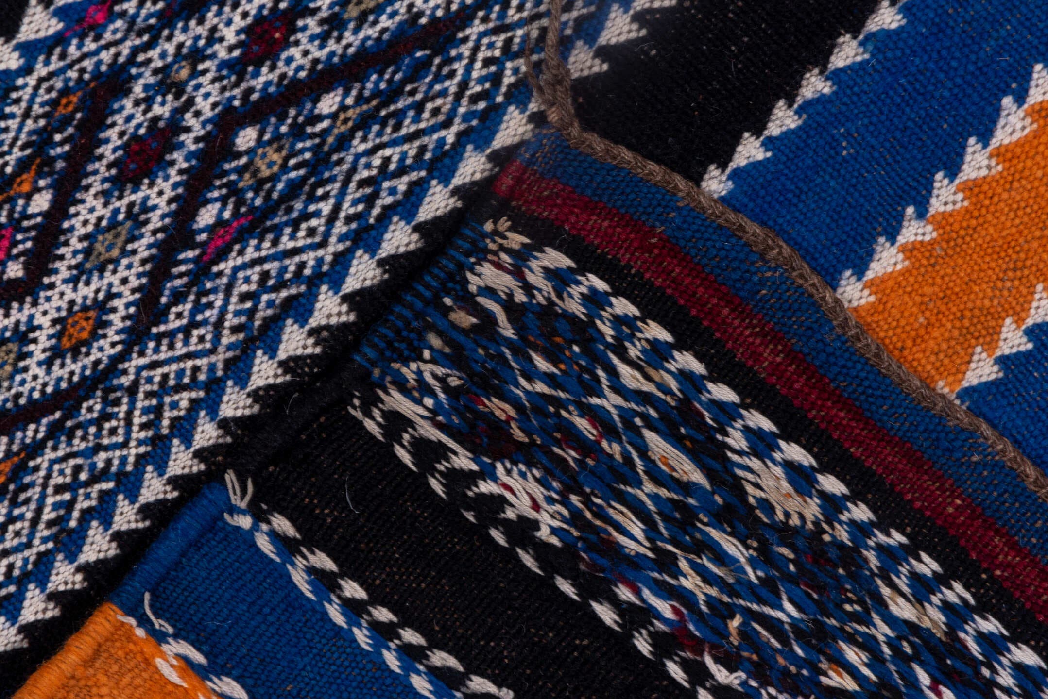 5' x 11' one-of-a-kind handmade vintage Kilim rug. Color palette: indigo, ivory, charcoal, rust, burgundy, blue, purple