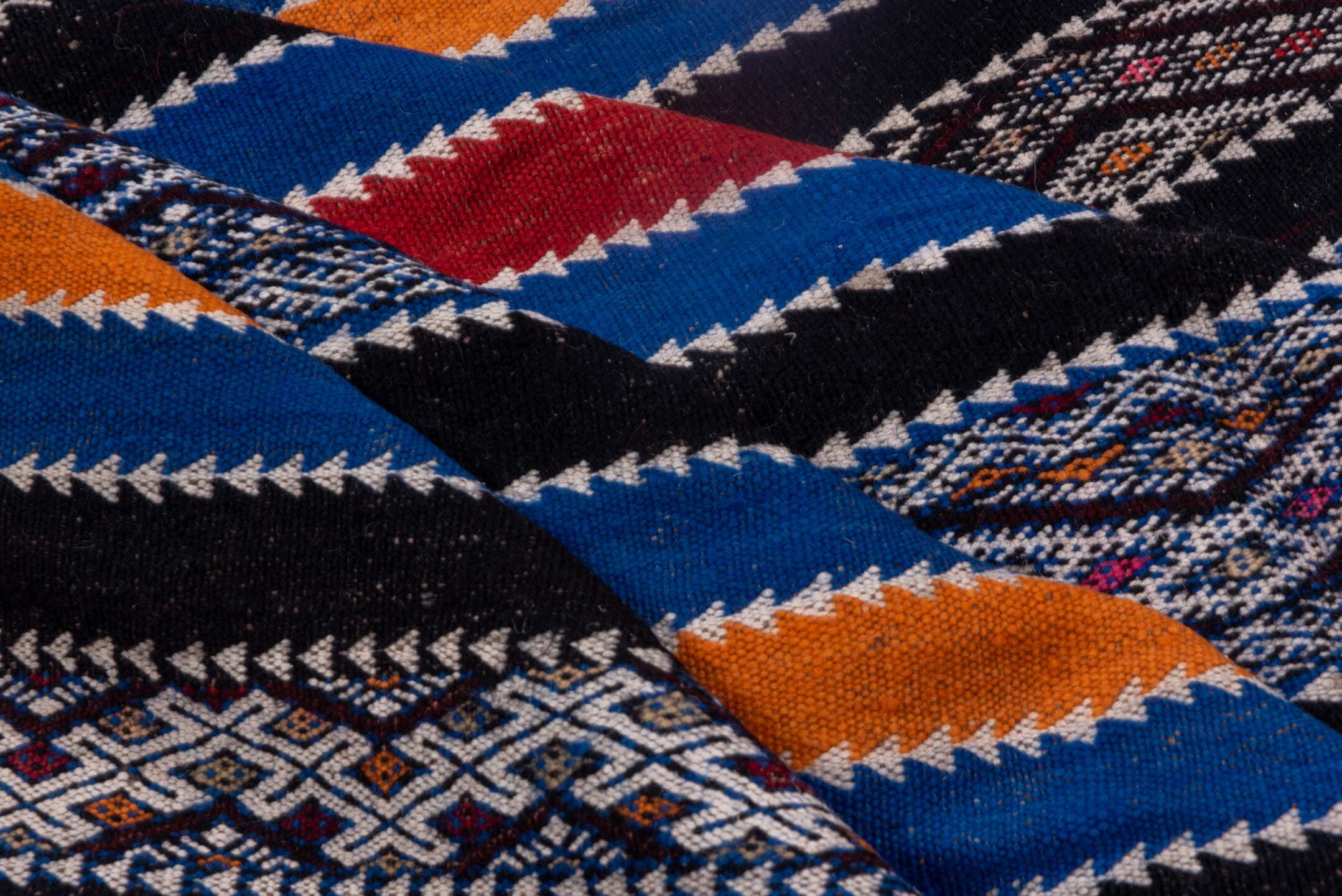 5' x 11' one-of-a-kind handmade vintage Kilim rug. Color palette: indigo, ivory, charcoal, rust, burgundy, blue, purple