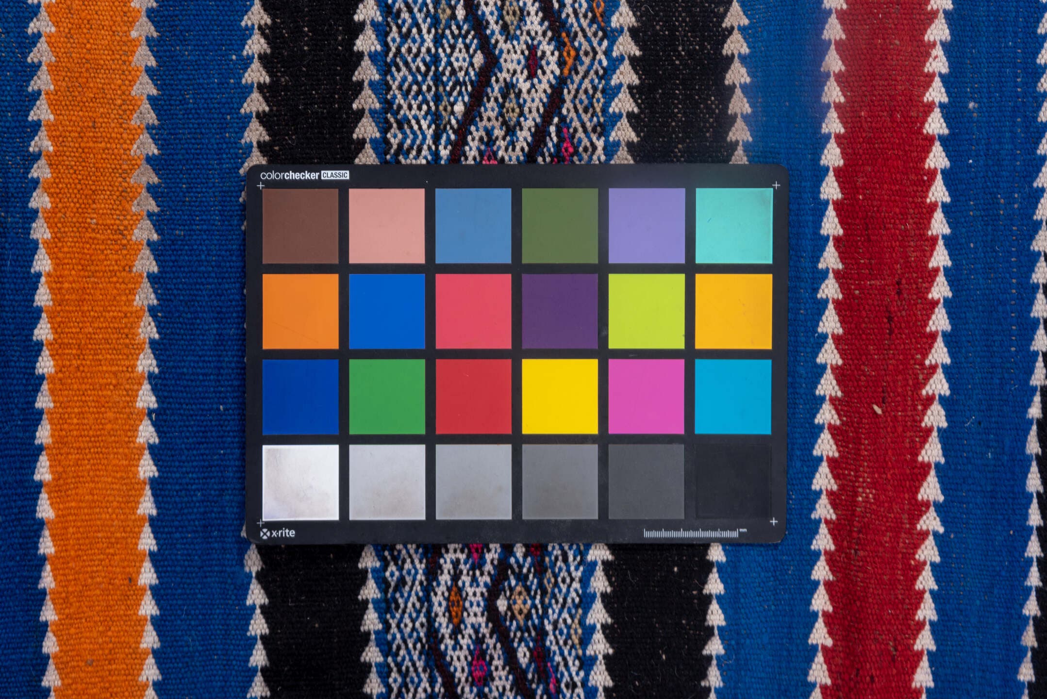 5' x 11' one-of-a-kind handmade vintage Kilim rug. Color palette: indigo, ivory, charcoal, rust, burgundy, blue, purple