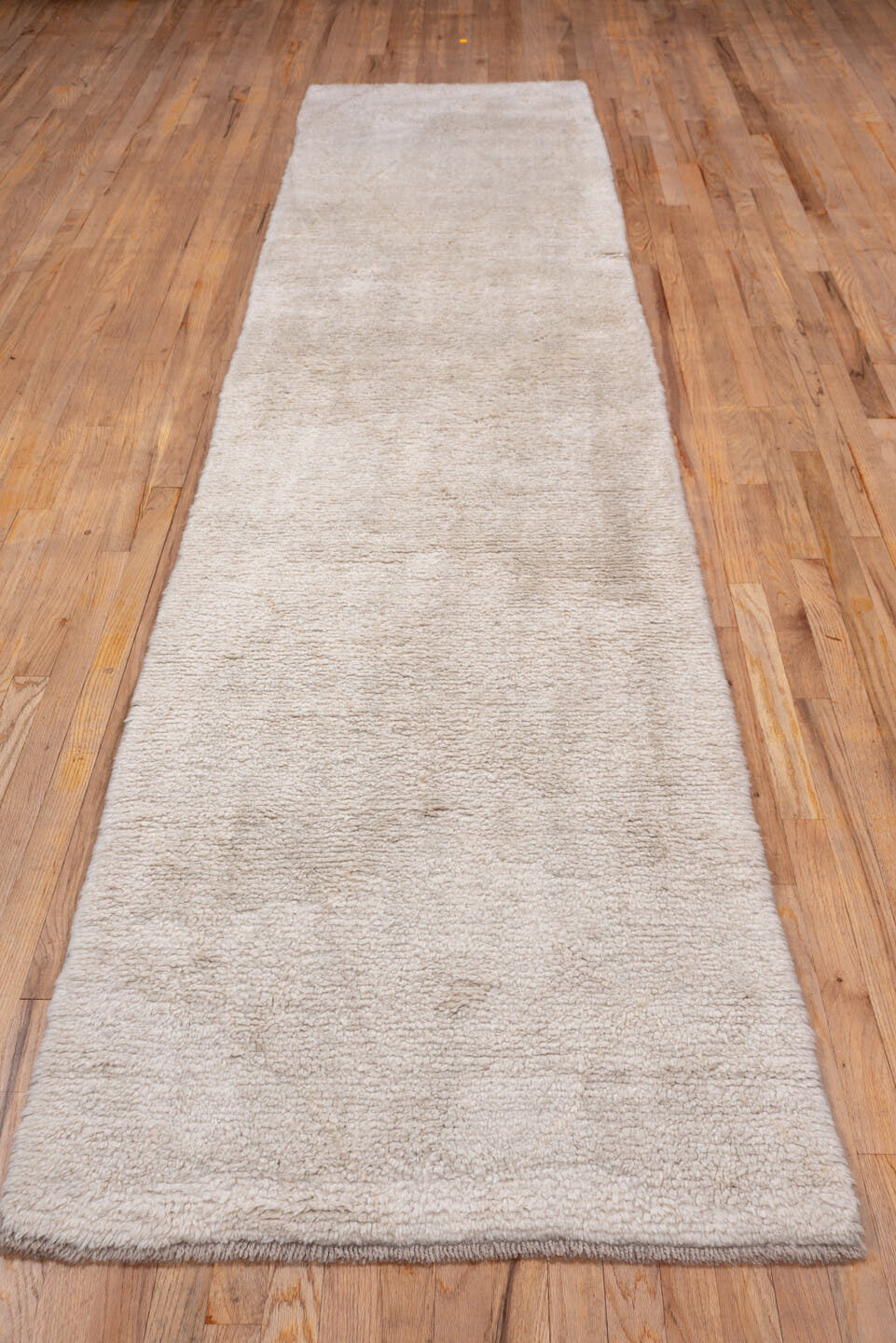 2' x 12' one-of-a-kind handmade vintage Moroccan runner rug. Color palette: ivory, cream, beige