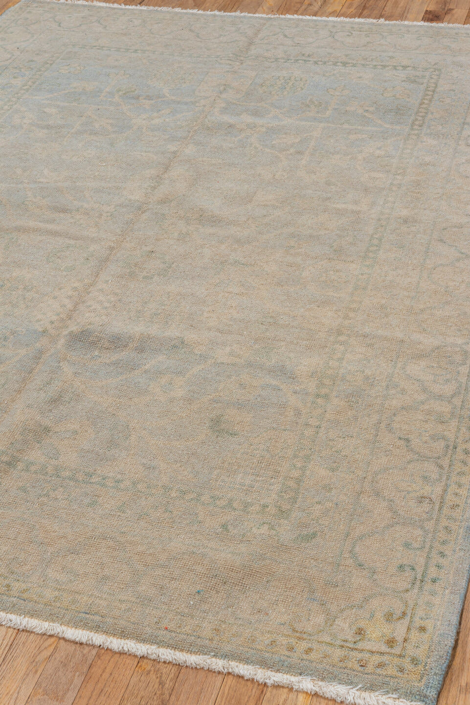 5' x 7' one-of-a-kind handmade vintage Khotan rug. Color palette: beige, ivory, pale blue, taupe, sage, light blue, gray
