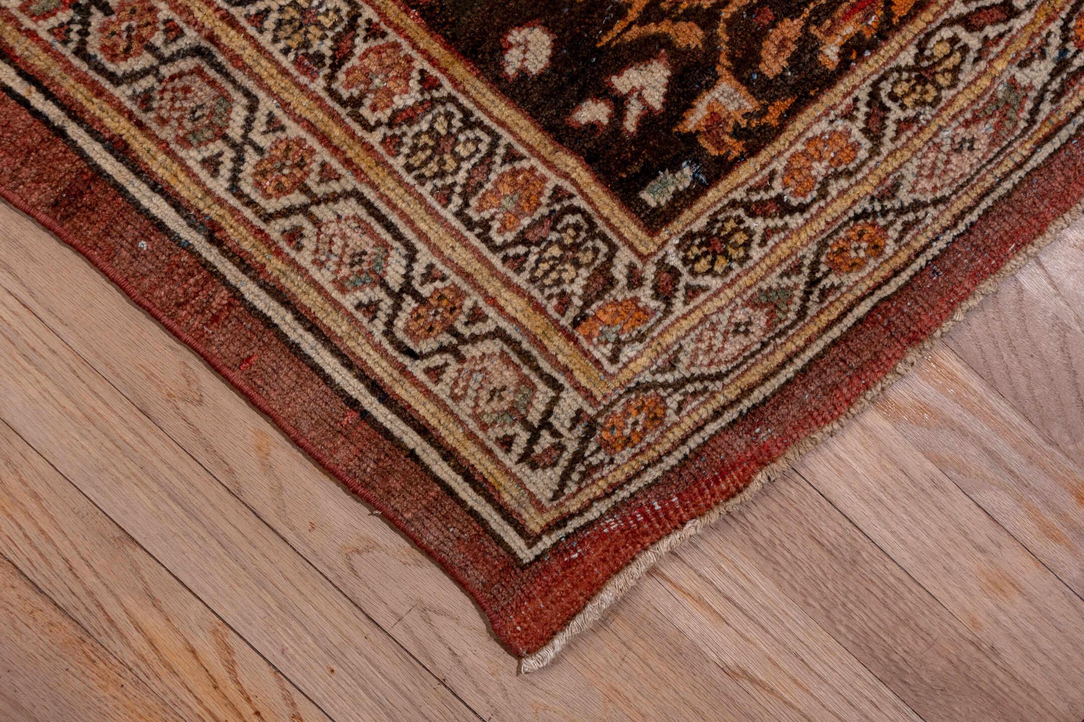 11' x 19' one-of-a-kind handmade antique Sultanabad oversize rug. Color palette: terra cotta, brown, ivory, gold, navy, sage